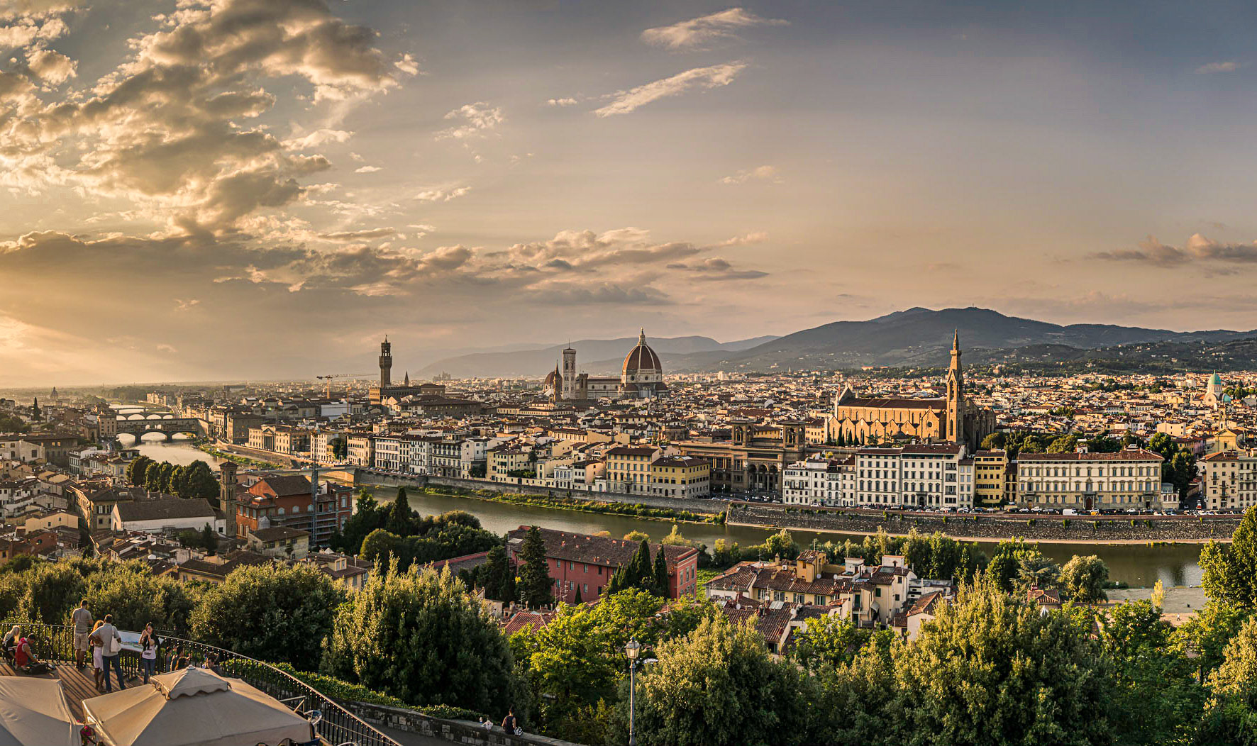 February 24, 2020View of the old city center of Firenze, Italia from the Piazzale Michelangelo as the sun was setting. This was shot on a trip celebrating my 40th wedding anniversary. The only camera I took was my little trusty Sony RX100 II camera (aside from my iPhone of course). This is a portion of an 8 shot pano that resulted in an image of 14,568 pixels by 5988 pixels or 40.5" x 16.6 @ 360 ppi.The reason I only took the little Sony is I wanted to stay married for the foreseeable future–no fancy cameras with interchangeable lenses and tripods on anniversary trips is the rule!