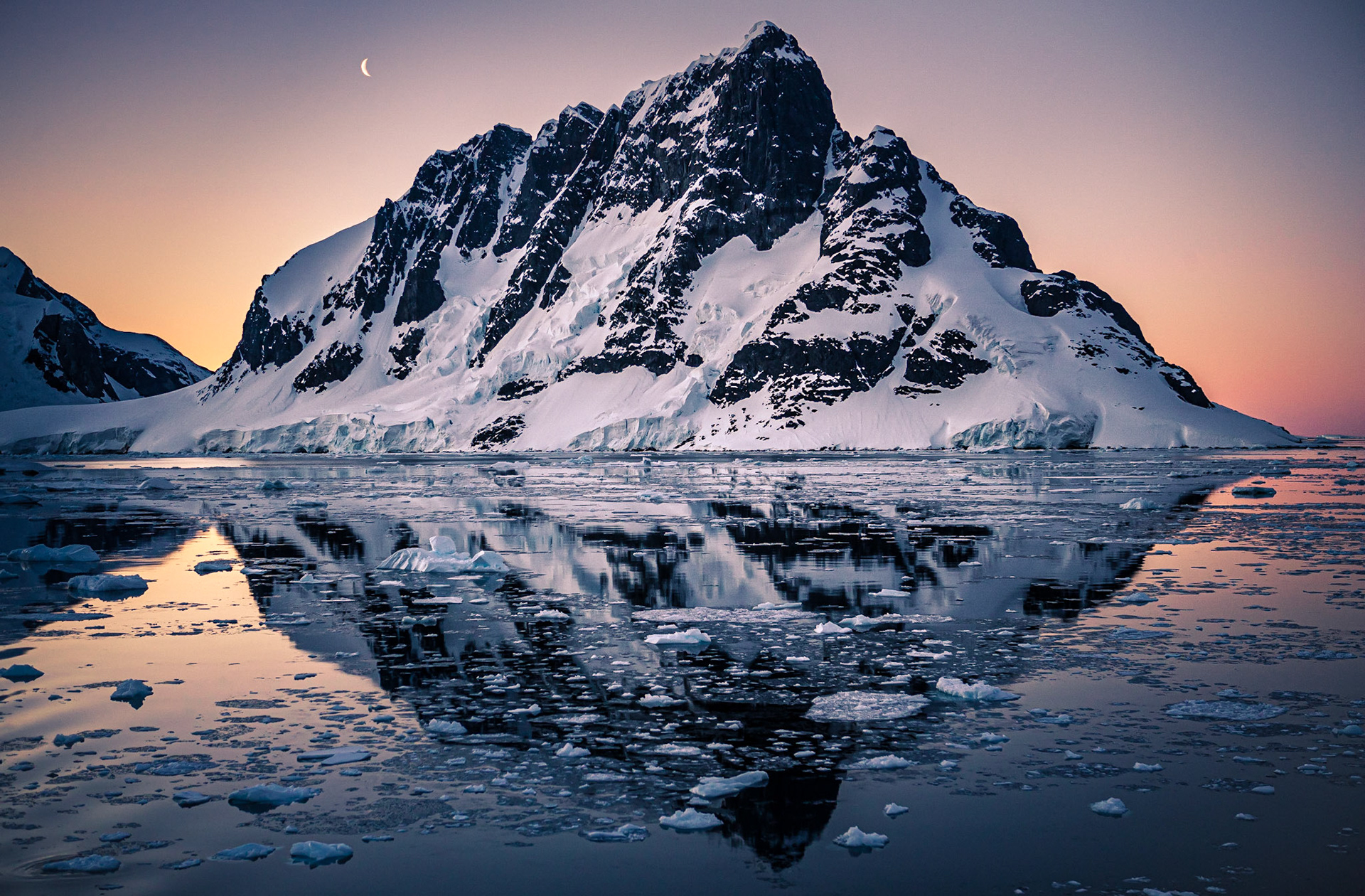 August 19, 2019Sunset behind Booth Island in the Lemaire Channel, Antarctic Peninsula.