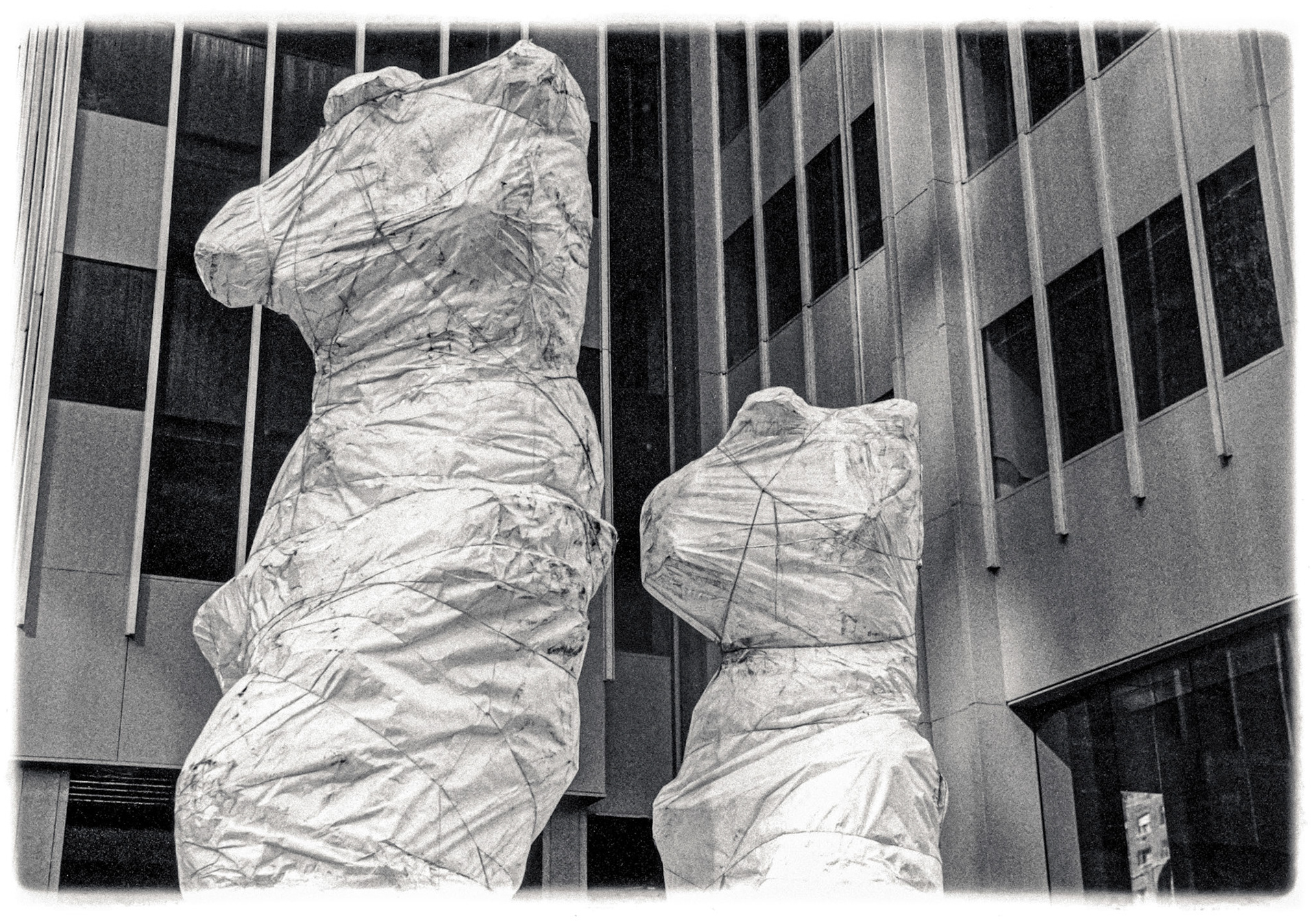 July 5, 2019  · Wrapped sculptures at the corner of 52nd Street and the Avenue of the Americas (6th Ave) in NYC.The two sculptures by artist Jim Dine are bronze renderings of "Venus de Milo" statues and with a 3rd sculpture on 53rd street are collectively titled "Looking Toward the Avenue".I happened to be in NYC in the fall of 1989 when the sculptures were being delivered and were still wrapped. Only recently did I happen to walk by and realize the wrapped sculptures weren't the final art. So, now I feel better about "owning it".