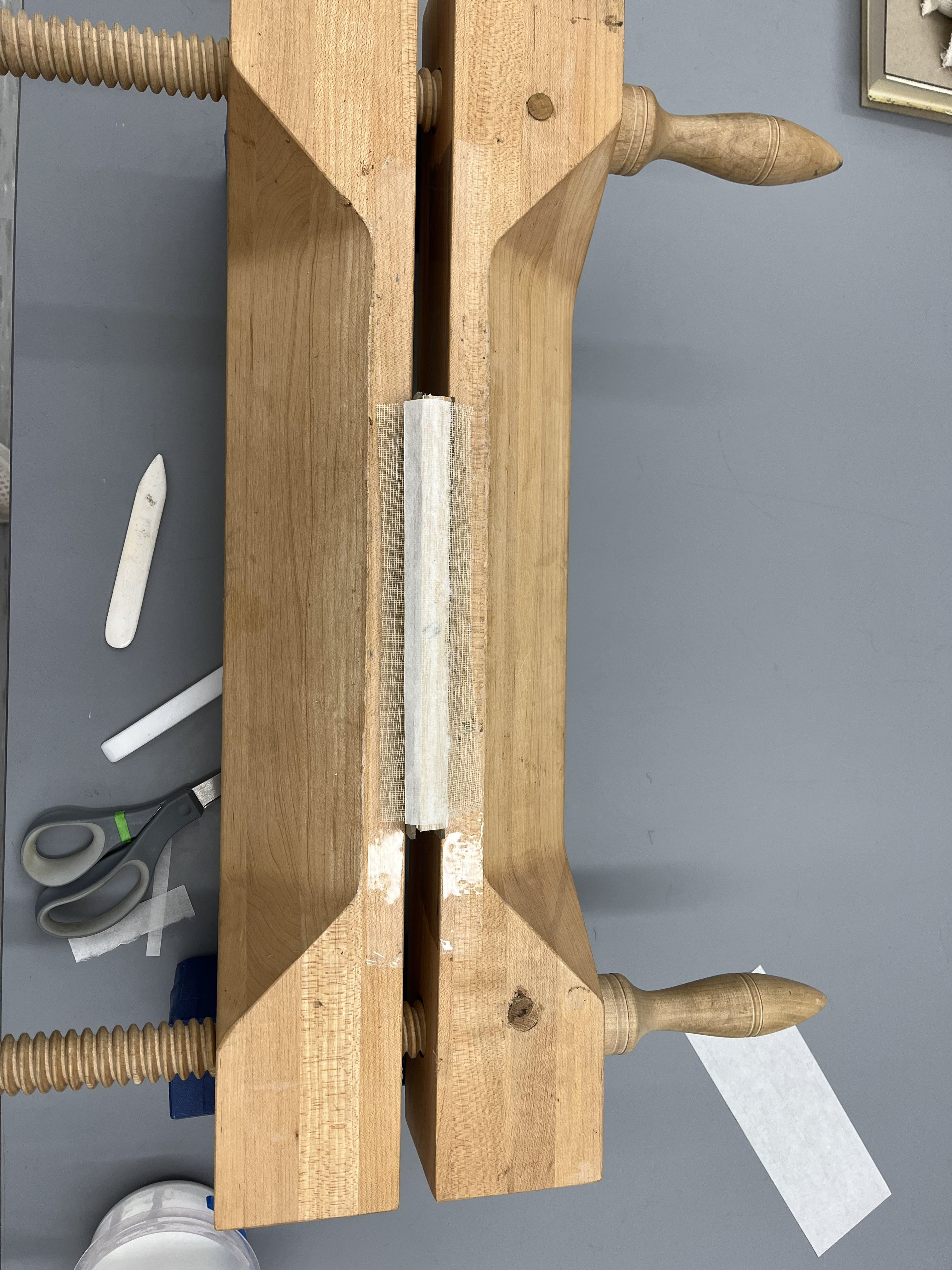 Text block in press to reinforce spine