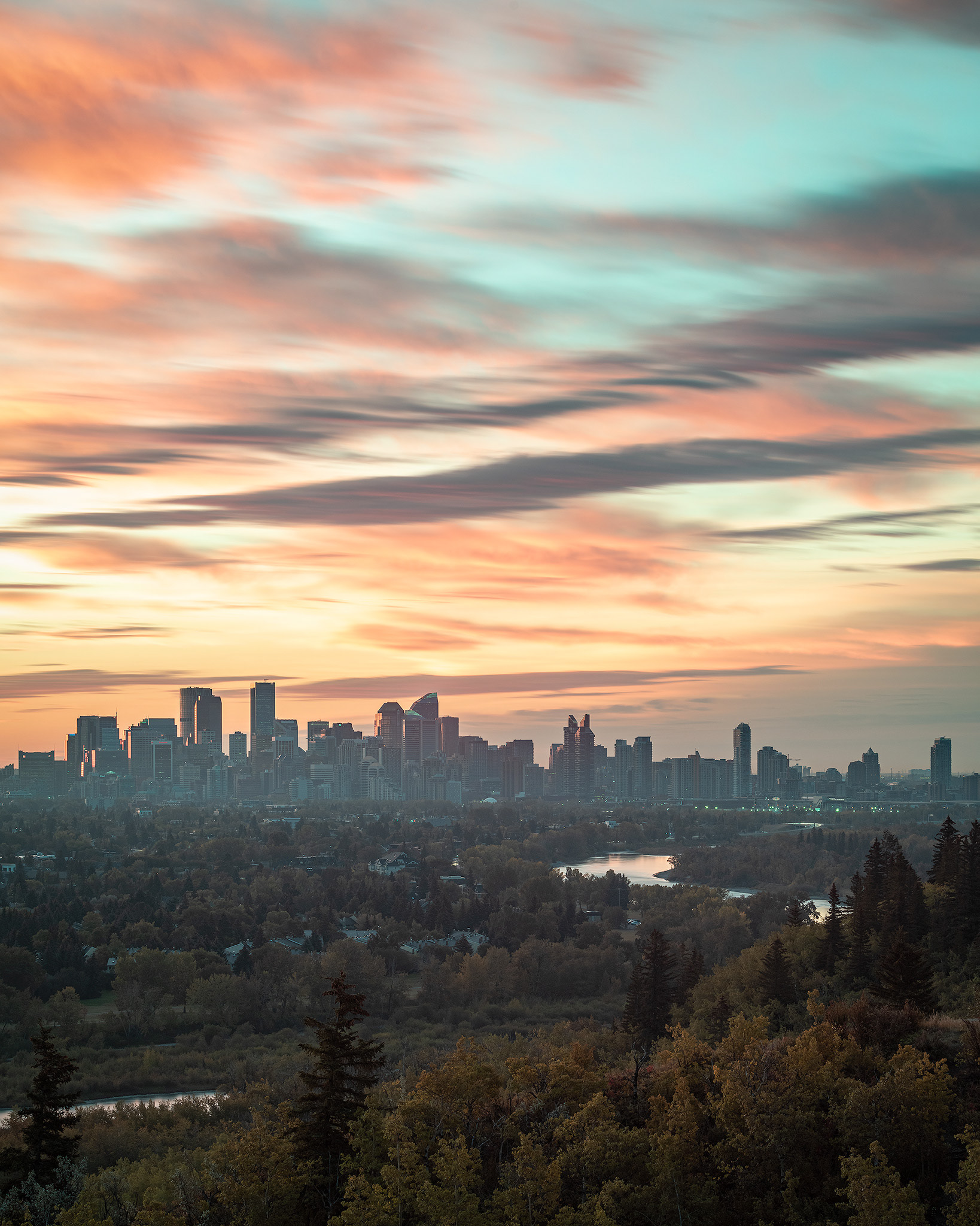 Pre rising Sun behind (and a little to the left) the Downtown Calgary skyline, from Edworthy Park, Calgary, AB - September 22nd (7:10 AM)