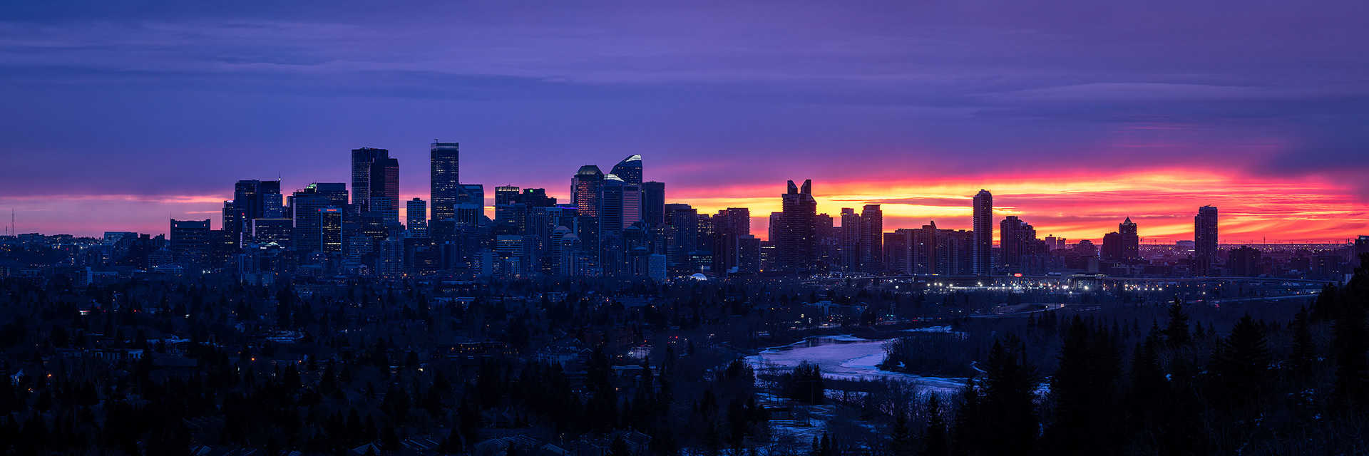 3x1 Panoramic Cityscape (8 shot) of the downtown skyline [pre sunrise, Civil Twilight (sun altitude -3 degrees)] from Edworthy Park, Calgary, AB
