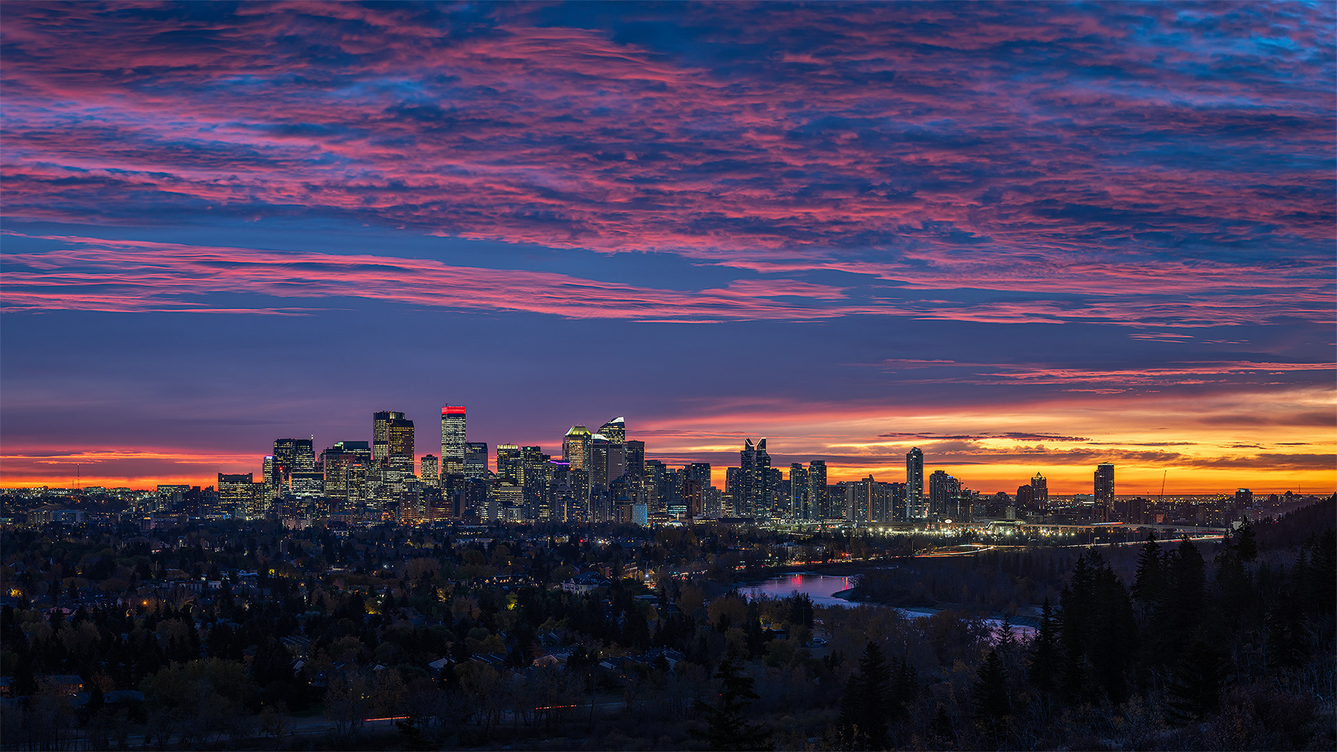 16:9 panoramic (5 shot) image of the Downtown Calgary skyline (38 minutes before Sunrise), from Edworthy Park, Calgary, AB - October 14th (7:21 AM, 100 Mp)