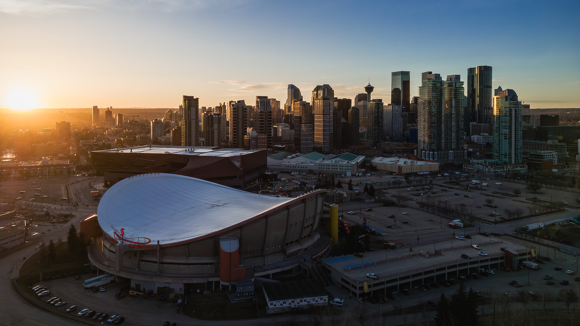 A photo of the Scotiabank Saddledome, with the Downtown Calgary skyline in the background, from near Scotsman's Hill, Calgary, AB - March 17th
