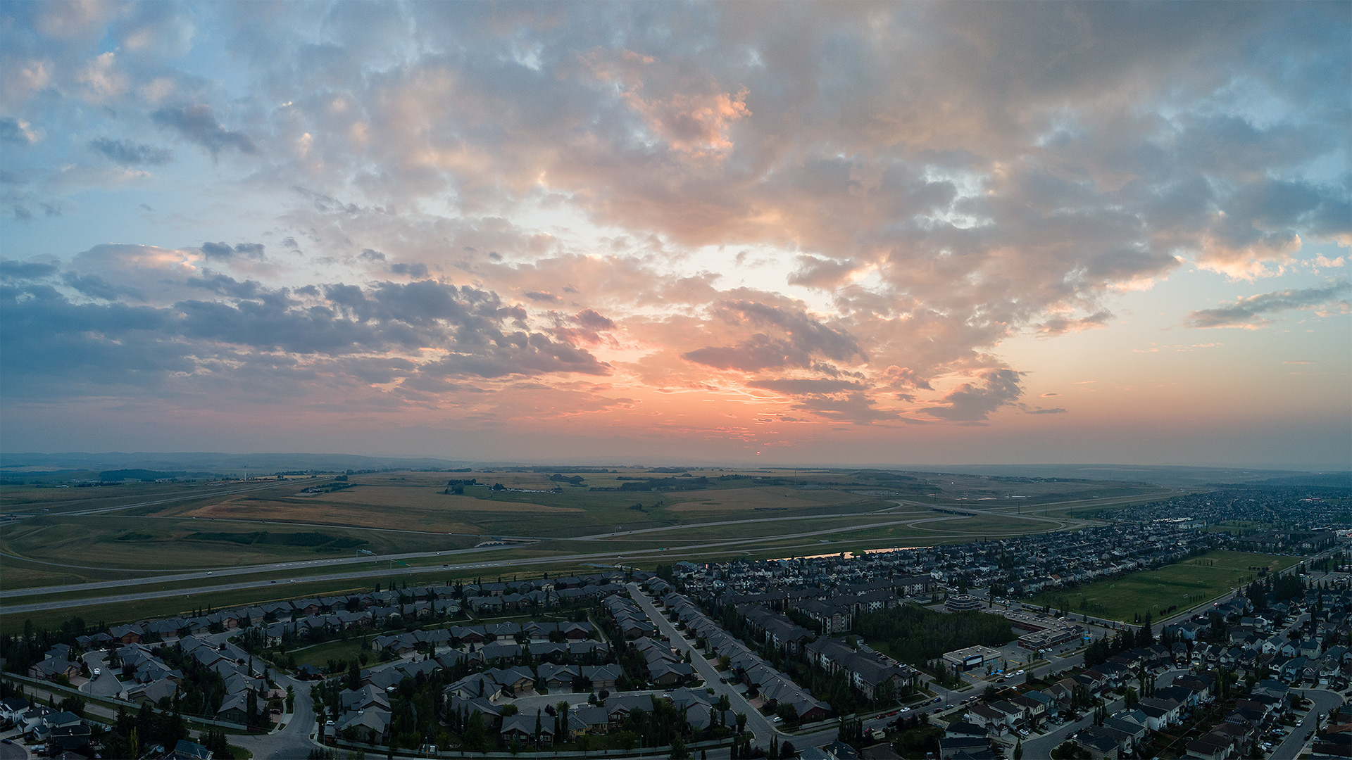 Sunset aerial photo from over the neighborhood of Bridlewood, Calgary, AB - August 14th