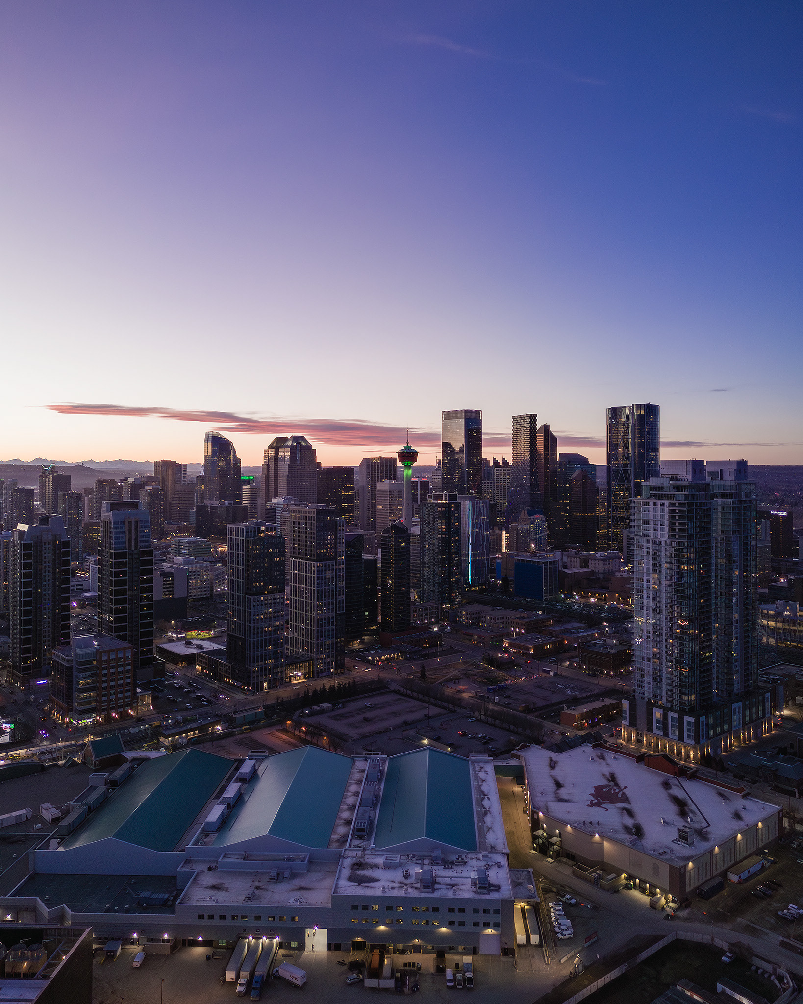 A photo of the BMO Centre, with the Downtown Calgary skyline in the background, from near Scotsman's Hill, Calgary, AB - March 17th