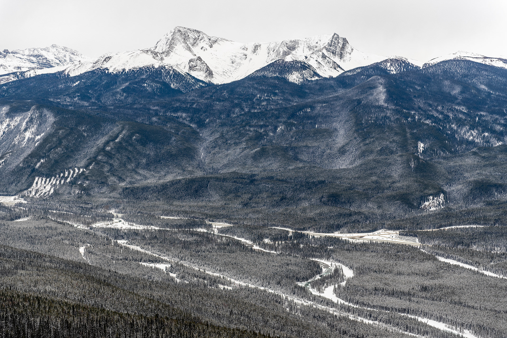 A view of the Bow Valley (Bow River, Castle Junction, Bow Valley Pkwy, Banff-Windermere Hwy, and Trans-Canada Hwy all shown) from the Castle Lookout hiking trail in Banff National Park, AB