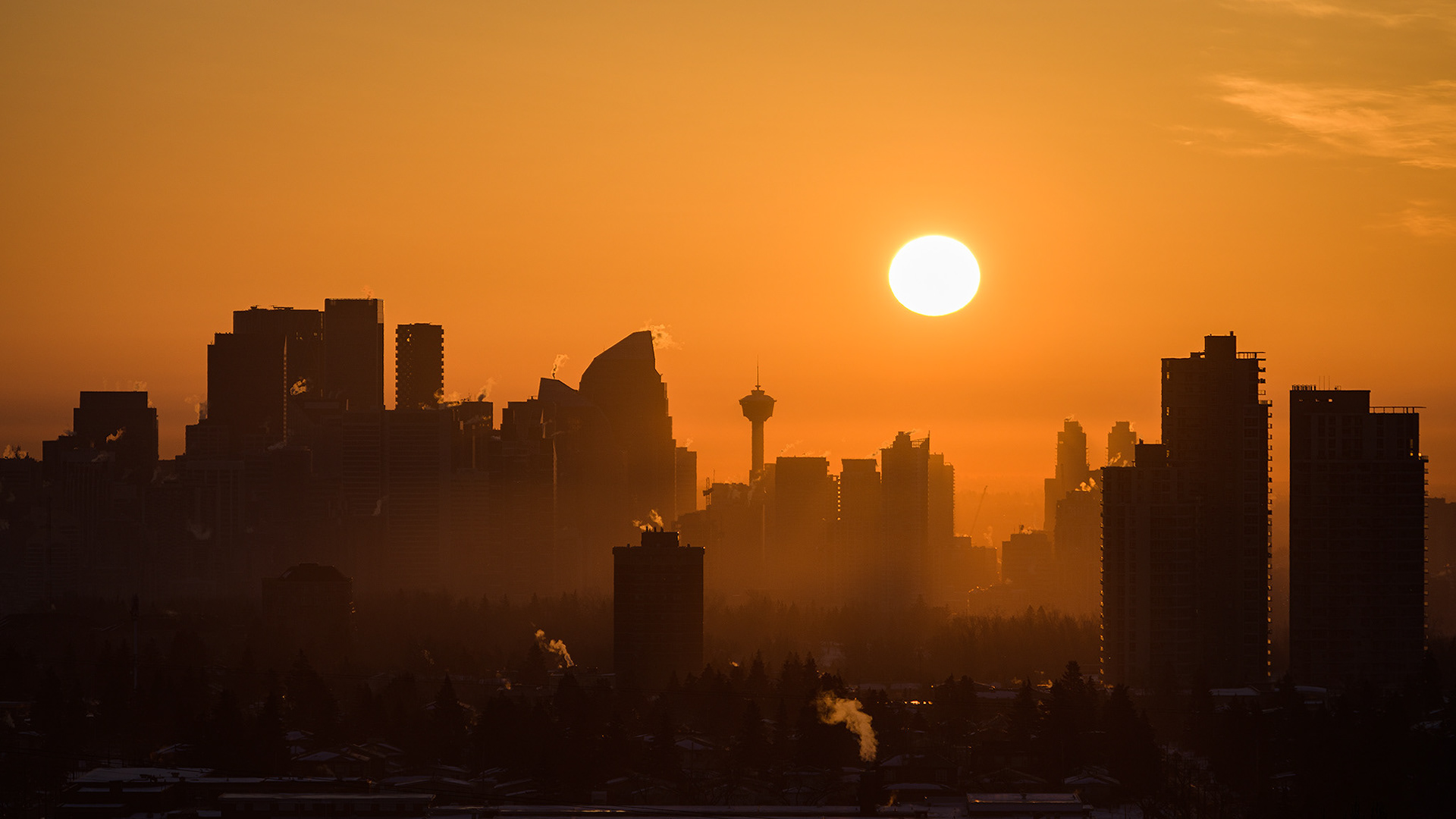 A photo of a portion of the Downtown Calgary skyline at Sunrise, from a park in Strathcona, Calgary, AB - March 20th (7:46 AM, 33 Mp, 16:9 crop)