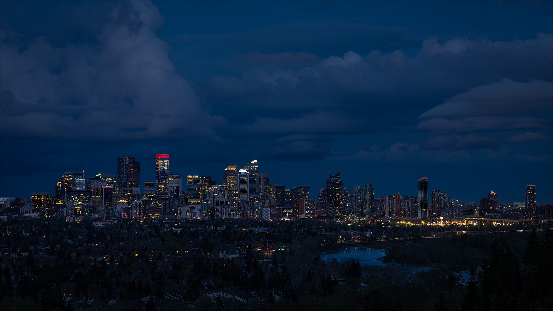 16x9 Panoramic Cityscape (5 shot) of the downtown skyline [Civil Twilight, Blue Hour (sun altitude -5.2 degrees)] from Edworthy Park, Calgary, AB