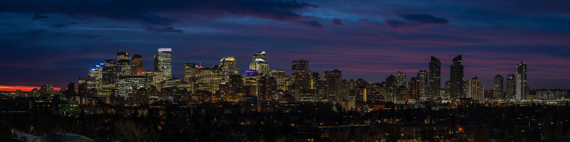 4x1 Panoramic Cityscape (10 shot) of the downtown skyline [pre sunrise, Nautical Twilight (sun altitude -8 degrees)] from West Hillhurst off-leash area, Calgary, AB
