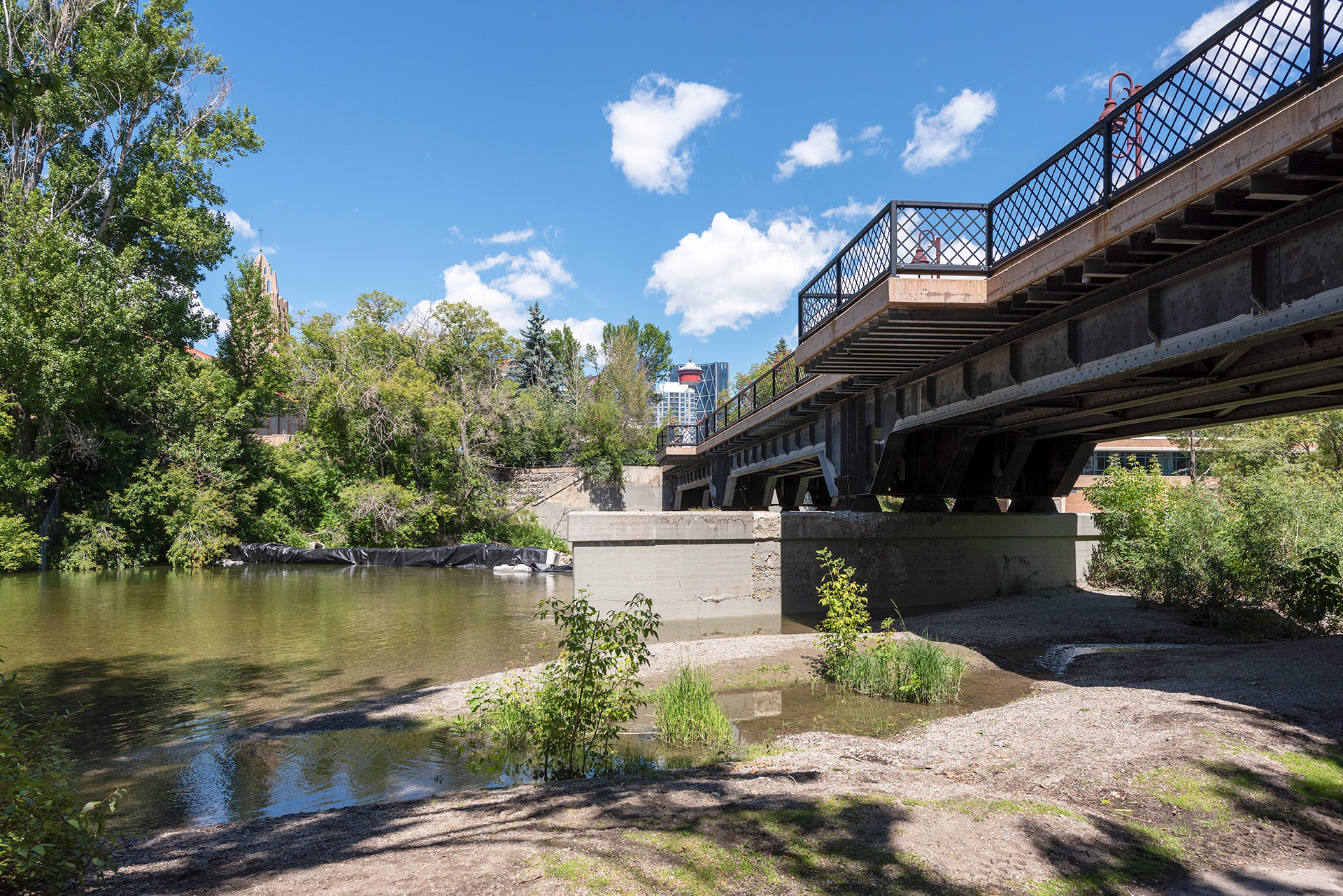 View of the Elbow River and a footbridge near Lindsay Park