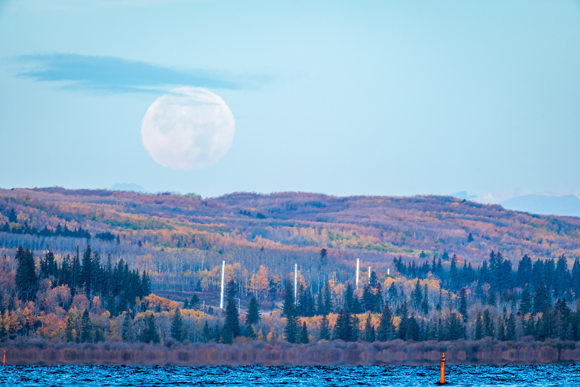 The Moon on its way to setting behind Weaselhead Flats, from the Glenmore Reservoir's water's edge, near The Big "H" of Heritage Park, Calgary, AB - October 10th (8:32 AM, 45 Mp)