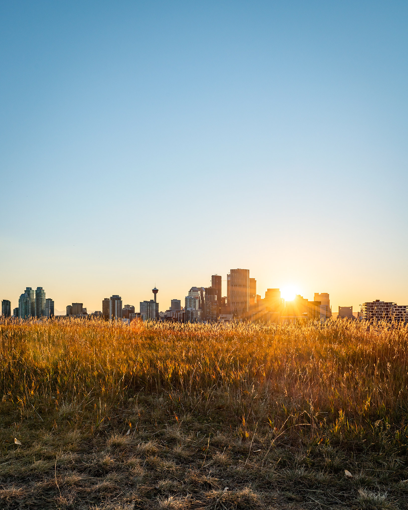 Setting Sun behind the Downtown Calgary skyline, from Tom Campbell's Hill Natural Park, Calgary, AB - September 21st (7:14 PM)