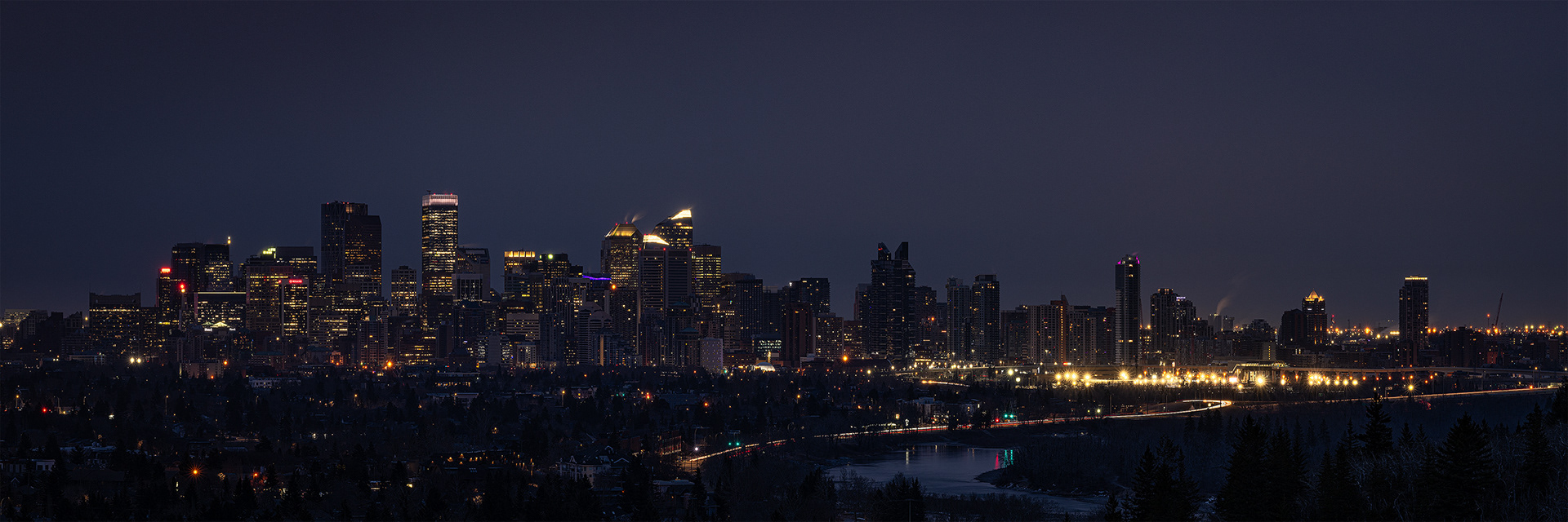 3x1 Panoramic Cityscape (7 shot) of the downtown skyline [pre sunrise, Civil Twilight (sun altitude -5.4 degrees)], from Edworthy Park, Calgary, AB