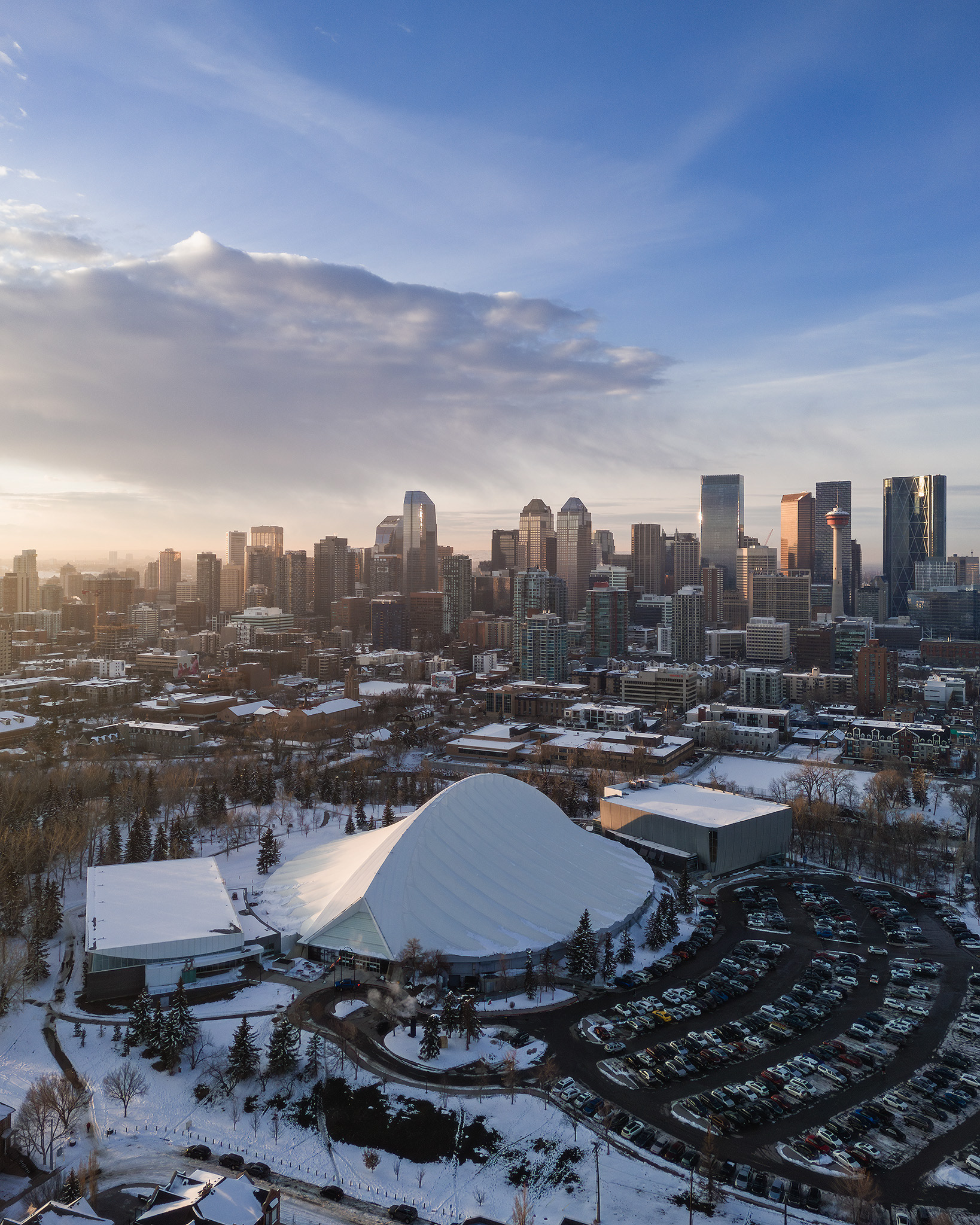 A photo of the MNP Community & Sport Centre, with the Downtown Calgary skyline in the background, from near Roxboro, Calgary, AB - March 26th