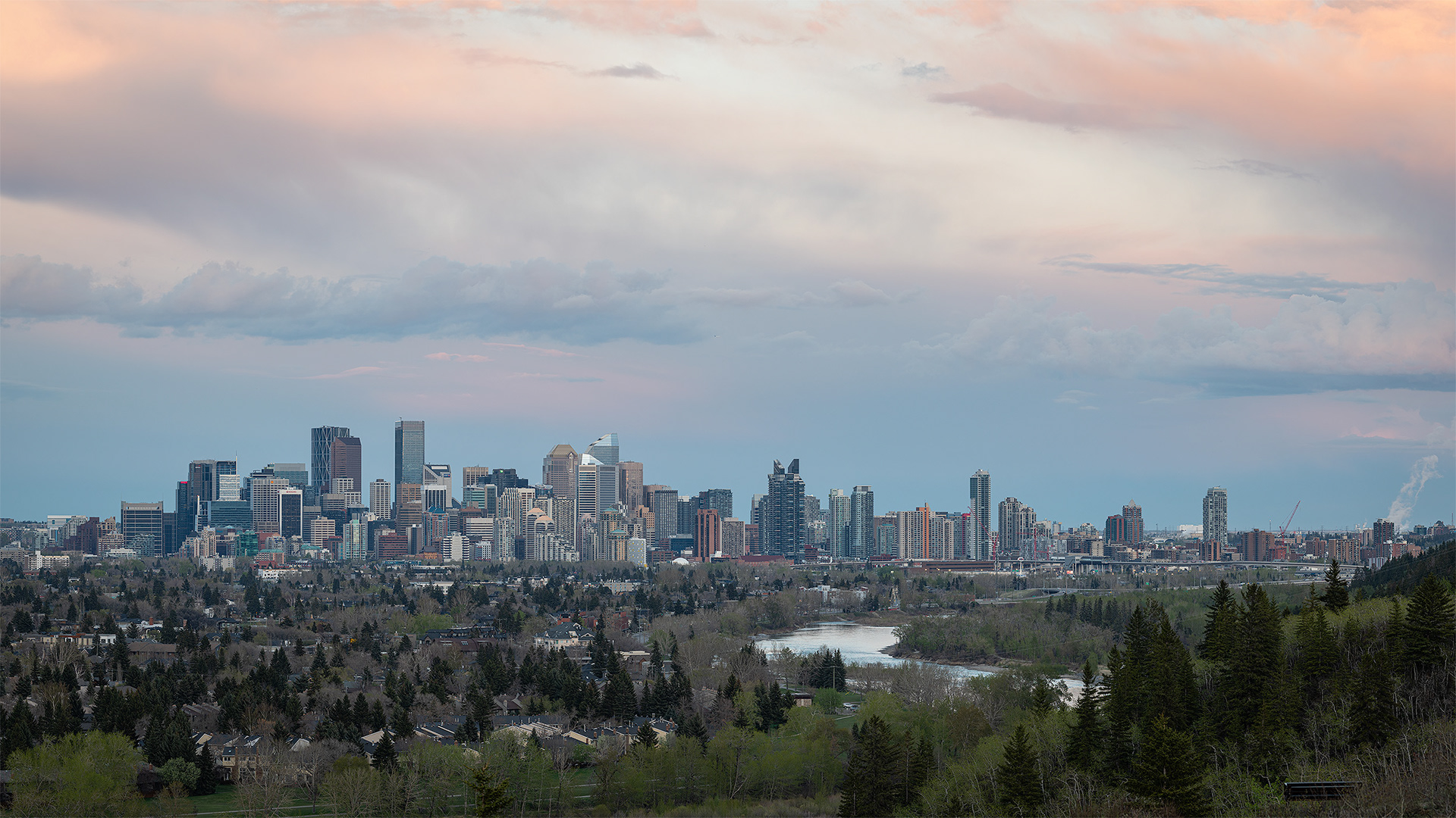 16x9 Panoramic Cityscape (5 shot) of the downtown skyline [Sunset, Golden Hour (sun altitude 1.4 degrees)] from Edworthy Park, Calgary, AB