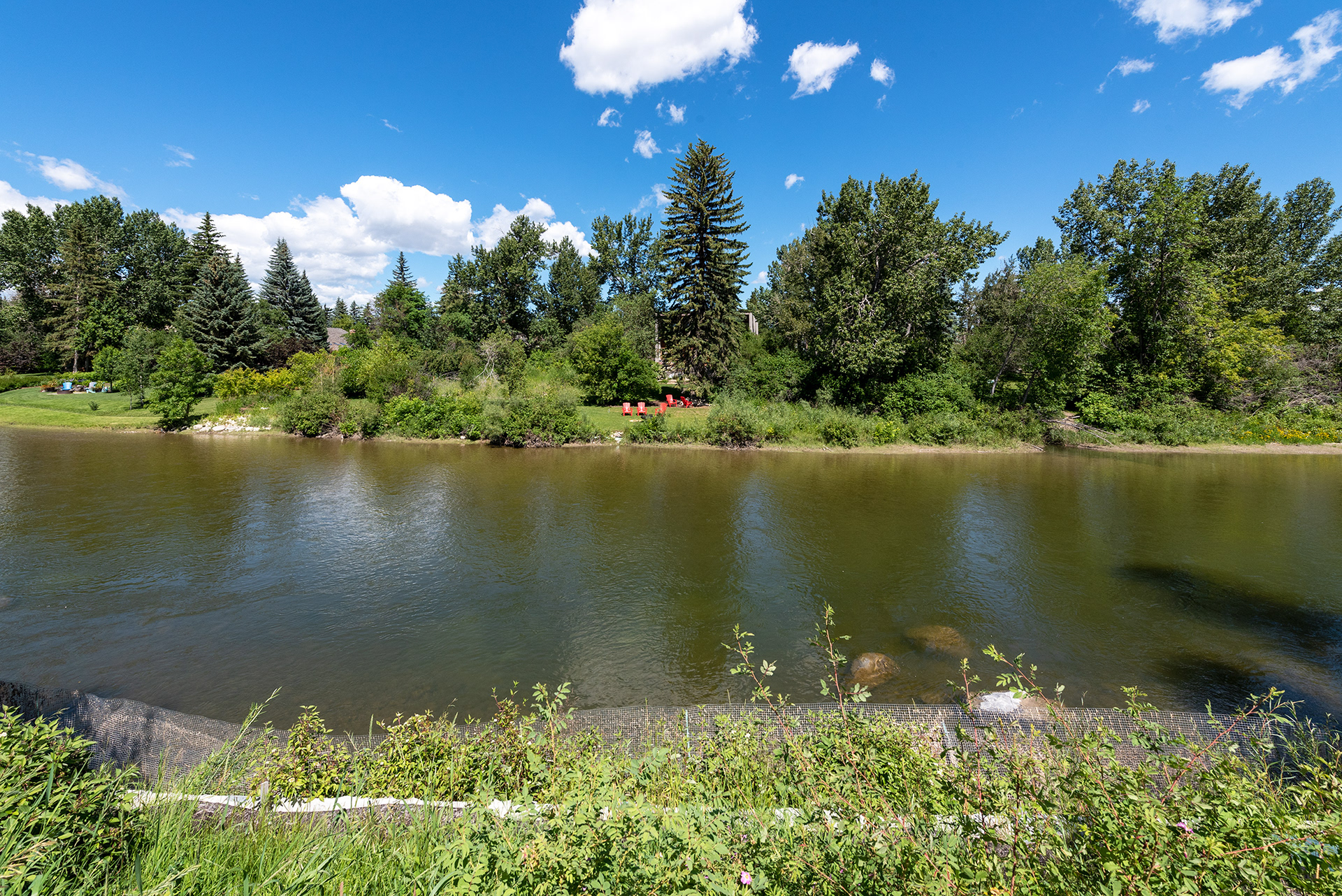 View of some very nice backyards across the Elbow River, from near Stanley Park