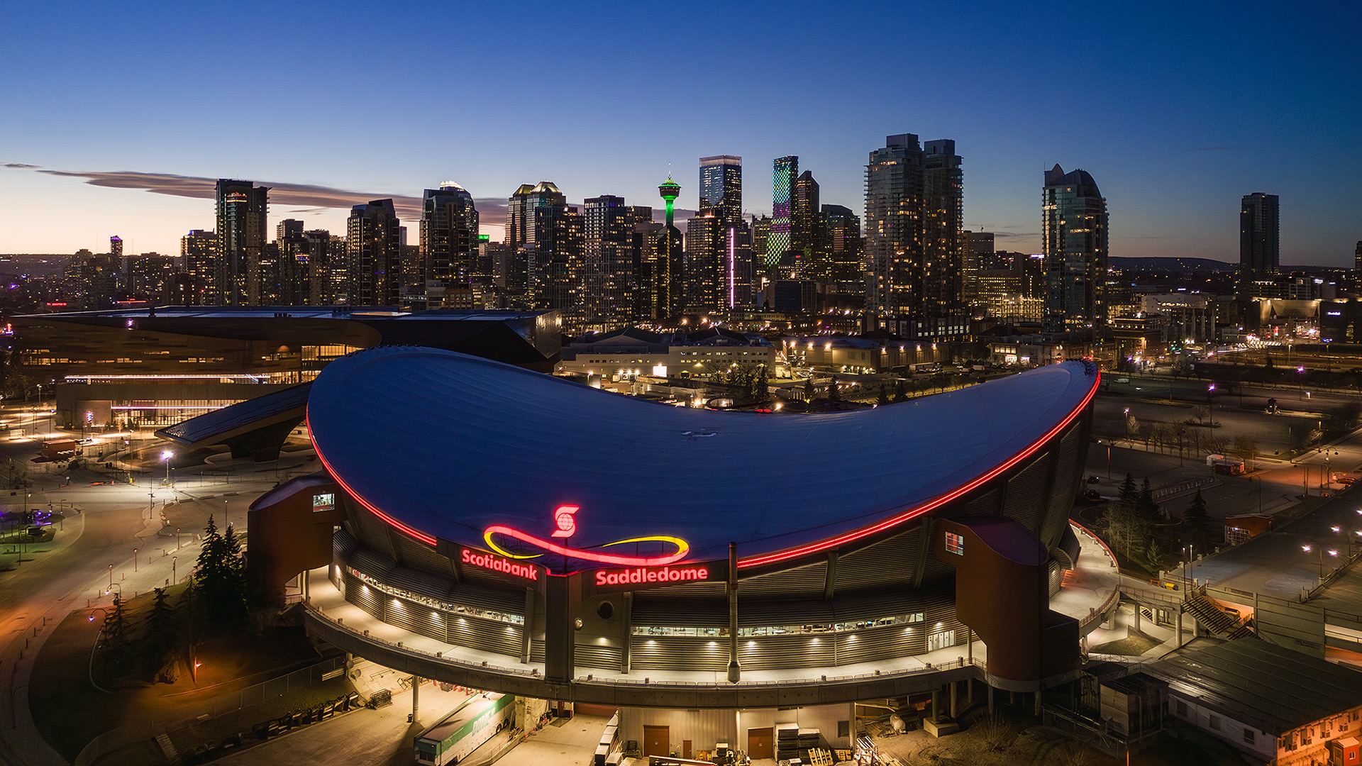 A photo of the Scotiabank Saddledome, with the Downtown Calgary skyline in the background, from near Scotsman's Hill, Calgary, AB - March 17th
