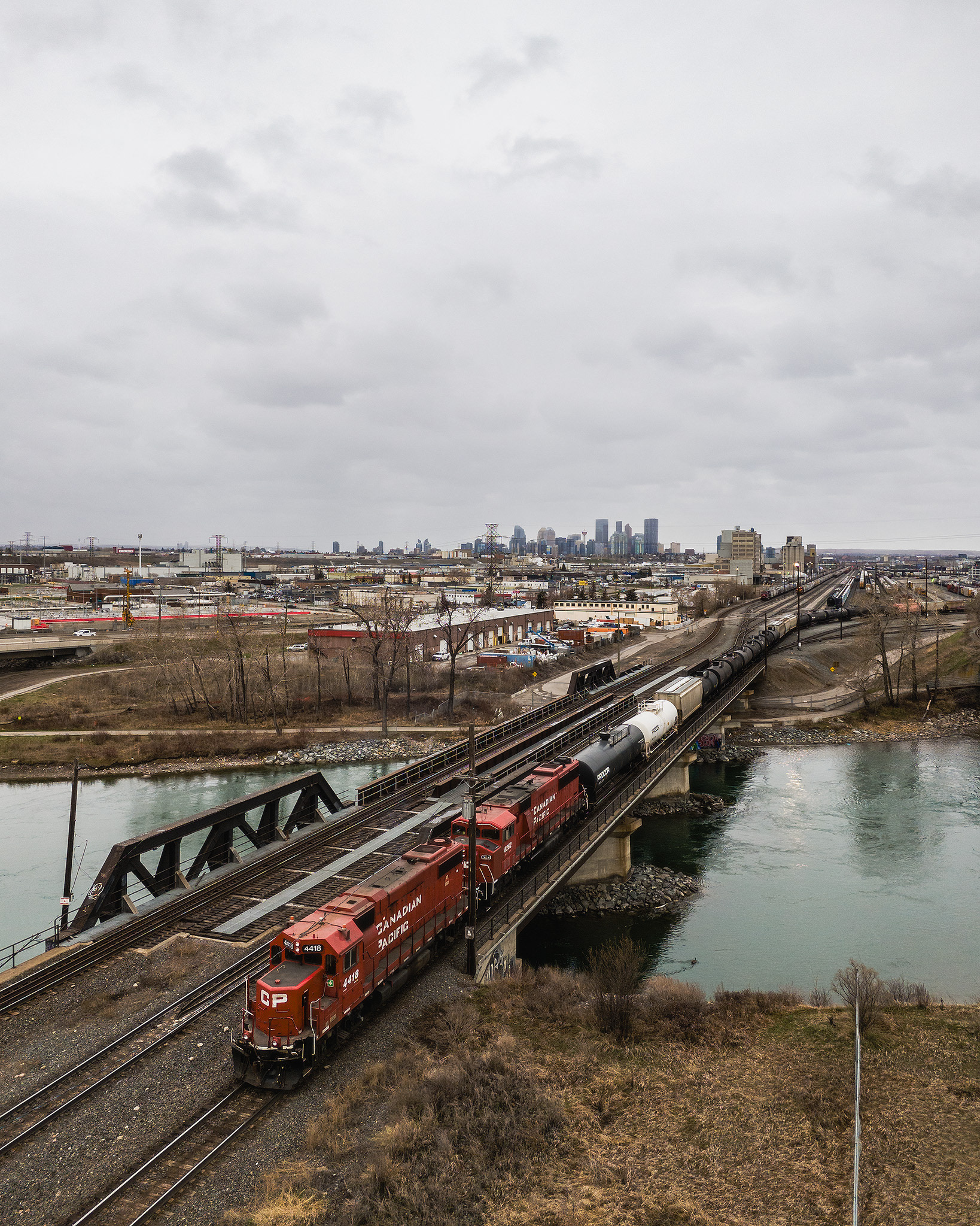 Photo of a train, with the Downtown Calgary skyline in the background, from near Southview Off Leash Dog Park, Calgary, AB - April 26th
