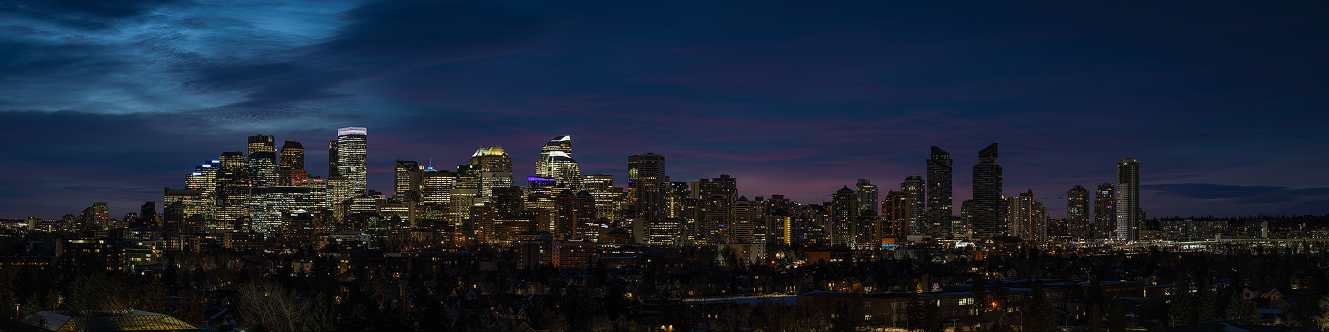 4x1 Panoramic Cityscape (9 shot) of the downtown skyline [pre sunrise, Nautical Twilight (sun altitude -8 degrees)] from Grasshopper Hill, West Hillhurst, Calgary, AB
