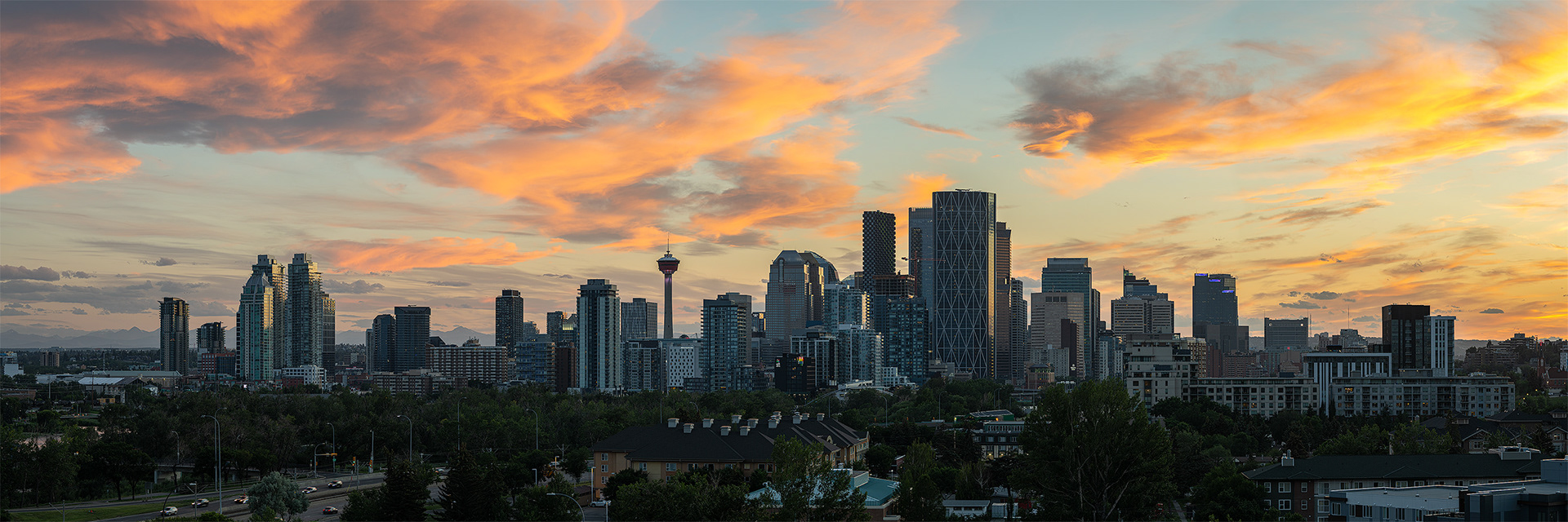 3x1 Panoramic Cityscape of the Downtown Calgary skyline at Sunset, from Tom Campbell's Hill Natural Park, Calgary, AB
