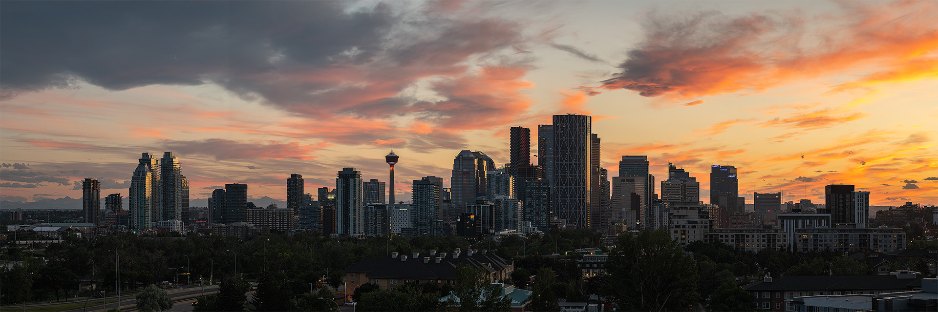 3x1 Panoramic Cityscape of the Downtown Calgary skyline at Sunset, from Tom Campbell's Hill Natural Park, Calgary, AB