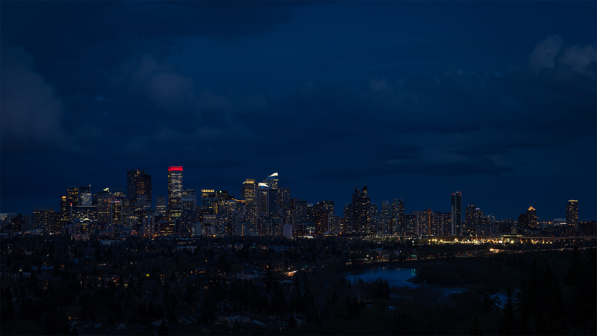 16x9 Panoramic Cityscape (5 shot) of the downtown skyline [Civil Twilight, Blue Hour (sun altitude -5.7 degrees)] from Edworthy Park, Calgary, AB