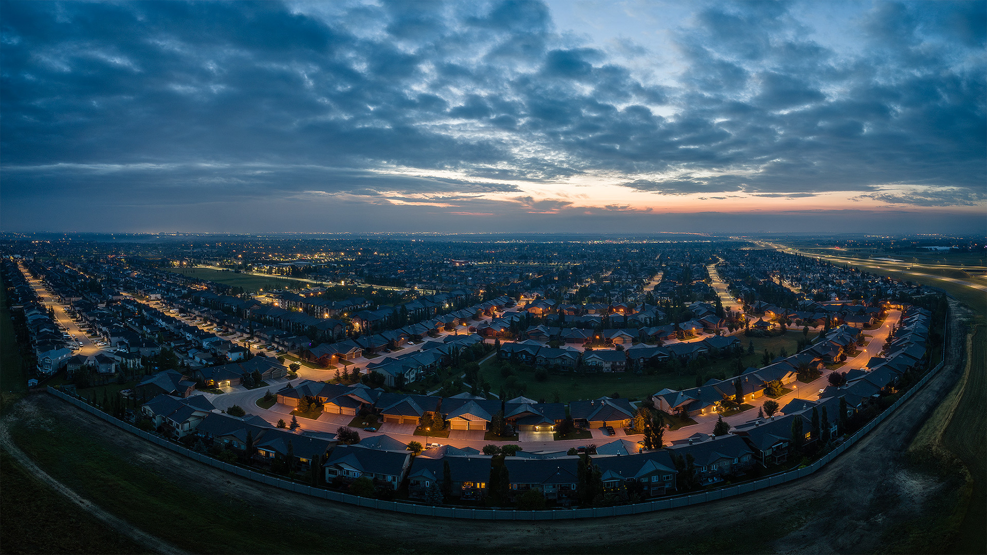 Panoramic sunrise aerial image from over the neighborhood of Bridlewood, Calgary, AB - August 17th
