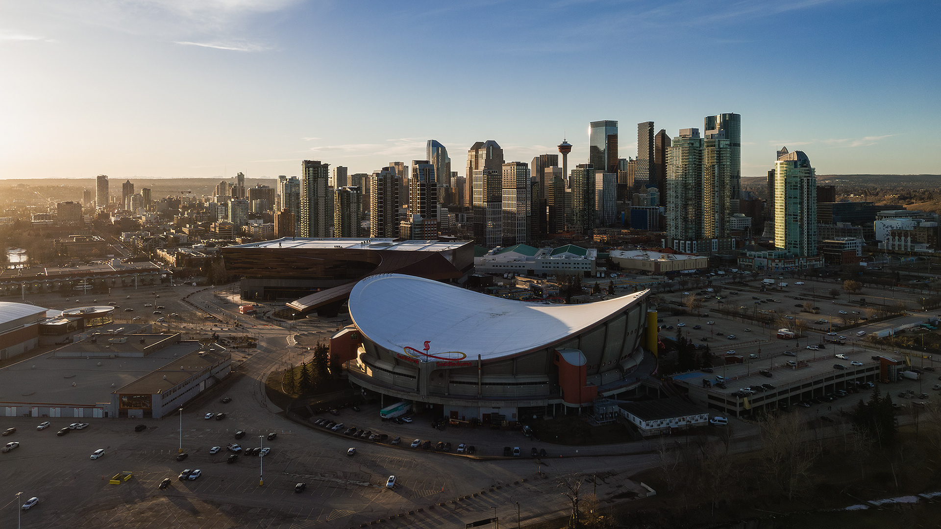 A photo of the Scotiabank Saddledome, with the Downtown Calgary skyline in the background, from near Scotsman's Hill, Calgary, AB - March 17th