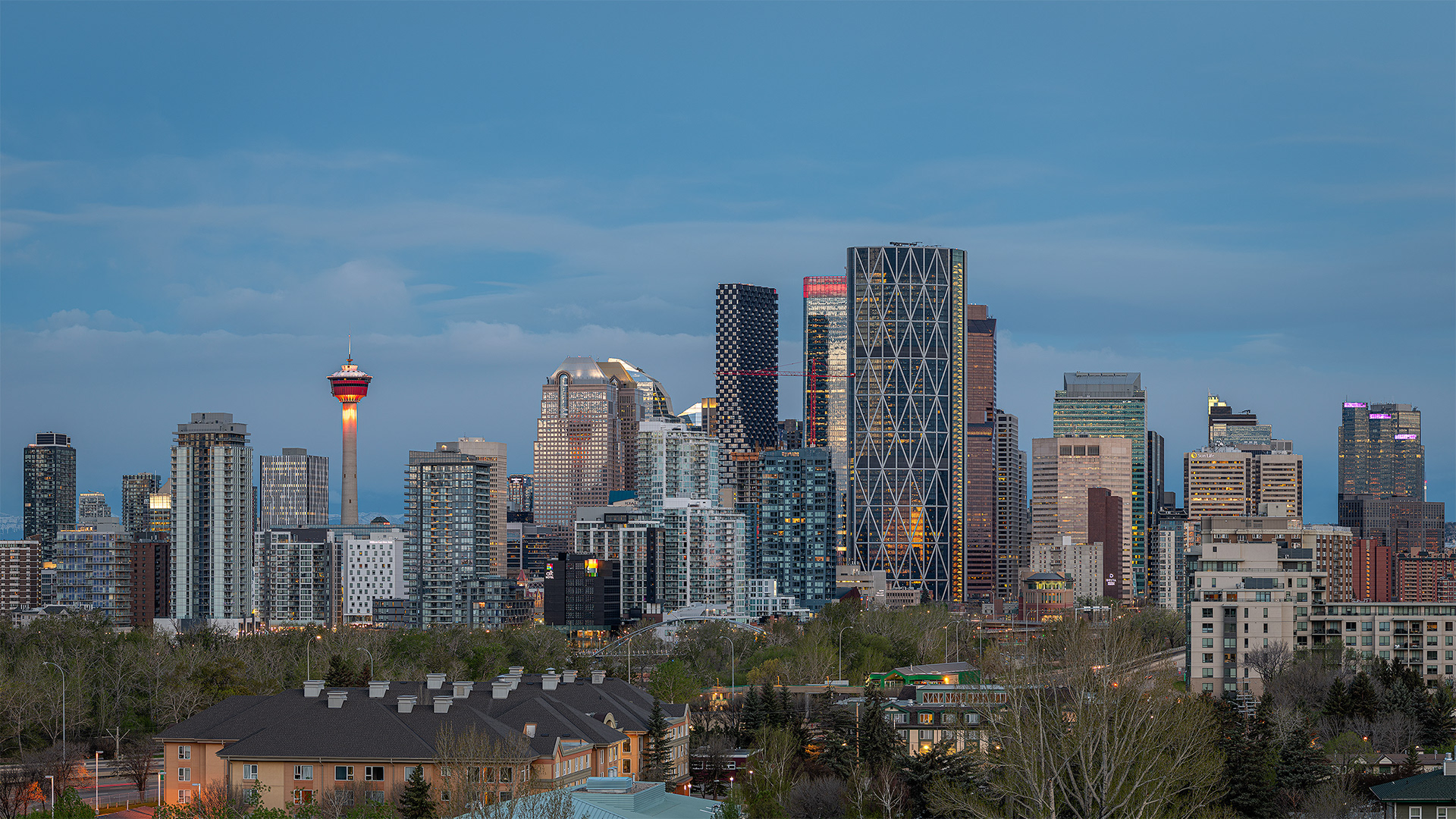 16x9 Panoramic Cityscape (4 shot) of the downtown skyline (Civil Twilight/Golden Hour, Sun elevation -3.6 degrees), from Tom Campbell's Hill Natural Park, Calgary, AB