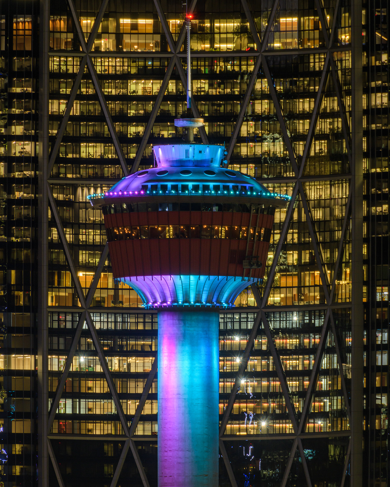 A close-up of the top of the Calgary Tower with the Bow building as the backdrop, Calgary, AB - February 27th (10:15 PM, 4:5 crop, 37 Mp)