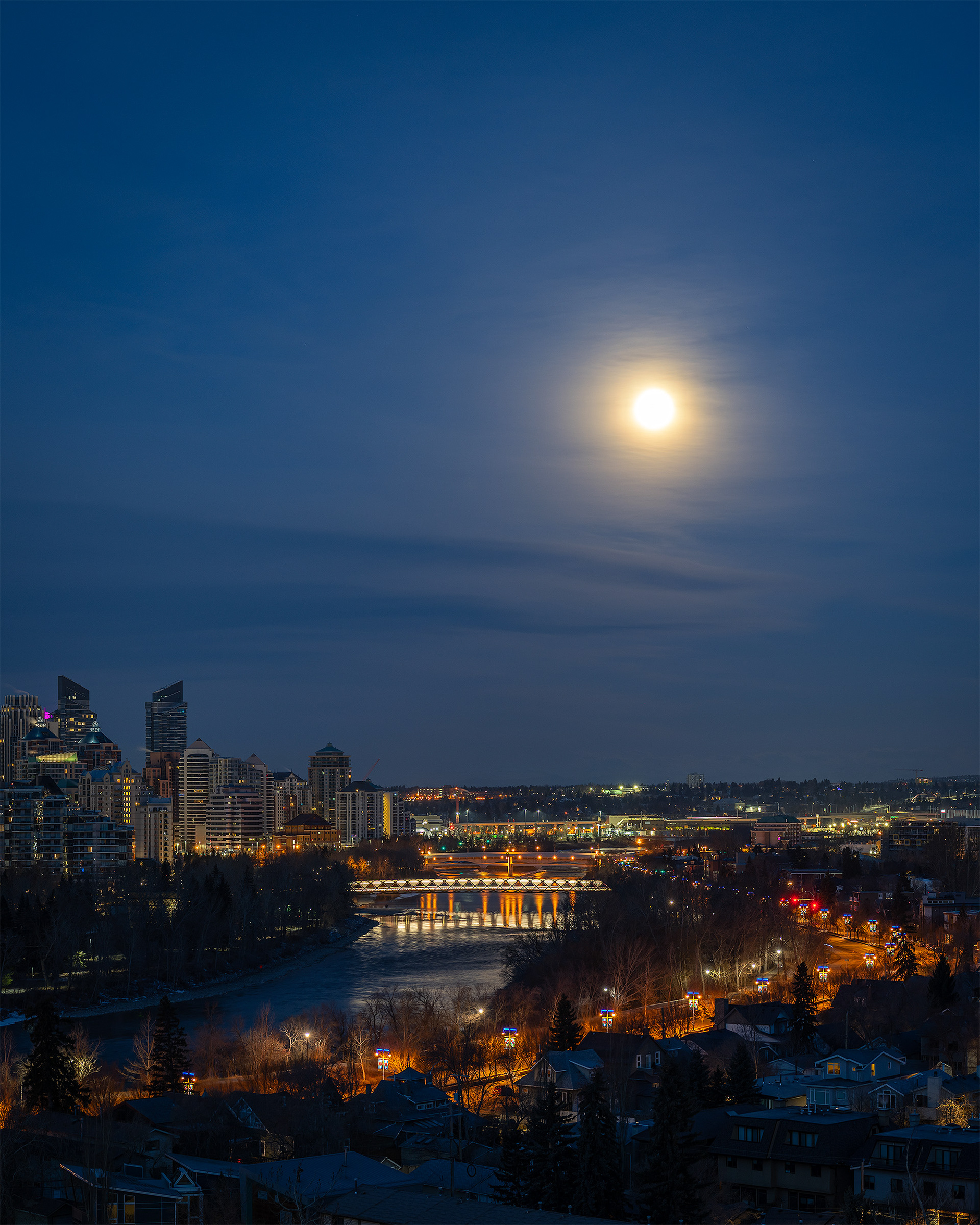 4x5 Cityscape (2 shot) of the Peace Bridge, Bow River, Memorial Dr., setting Moon, and a portion of the downtown skyline, [pre sunrise, Nautical Twilight (sun altitude -7.6 degrees)], from Crescent Heights Lookout Point, Calgary, AB