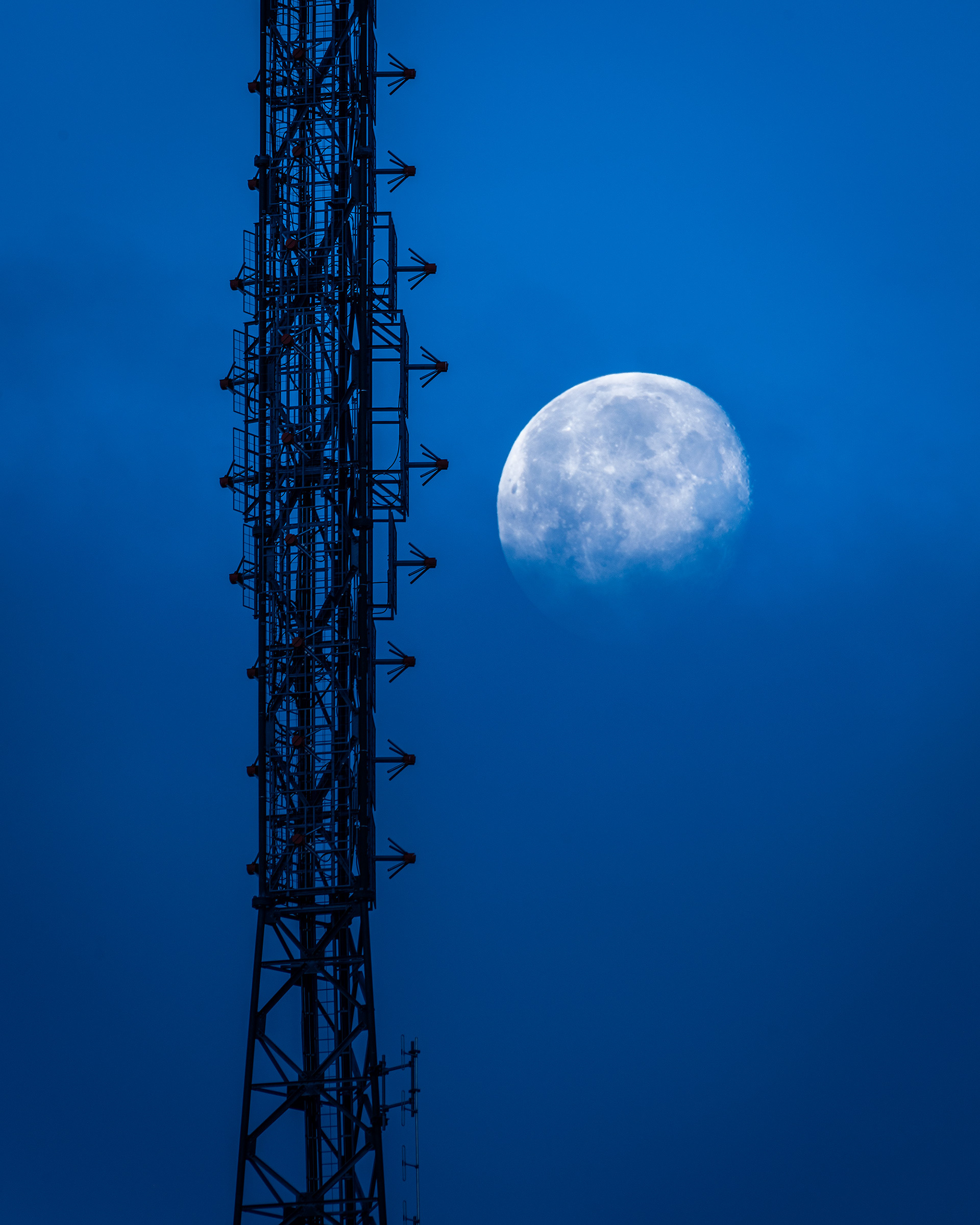 Moon (Waning Gibbous), and a tower (one of countless) along Sarcee Tr. from Edworthy Park (focus set on the tower), Calgary, AB