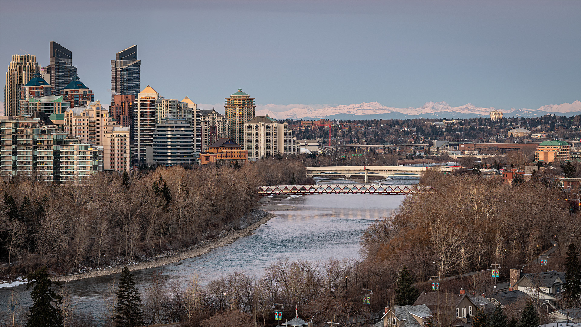 16x9 Cityscape (3 shot) of the Peace Bridge, Bow River, and a portion of the downtown skyline, from Crescent Heights Lookout Point, Calgary, AB