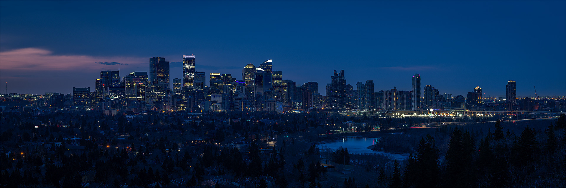 3x1 Panoramic Cityscape (7 shot) of the downtown skyline [pre sunrise, Civil Twilight (sun altitude -5.2 degrees)], from Edworthy Park, Calgary, AB