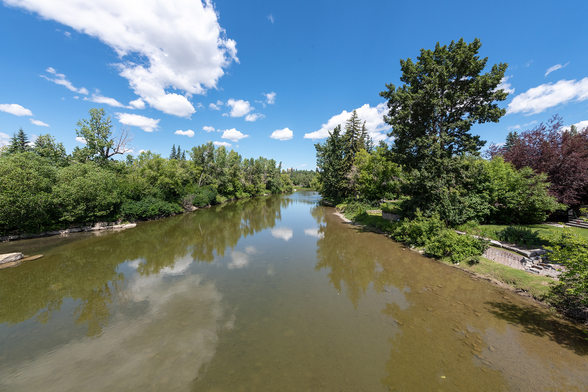 Downstream view of the Elbow River from on an Elbow River Suspension Bridge near Rideau Park