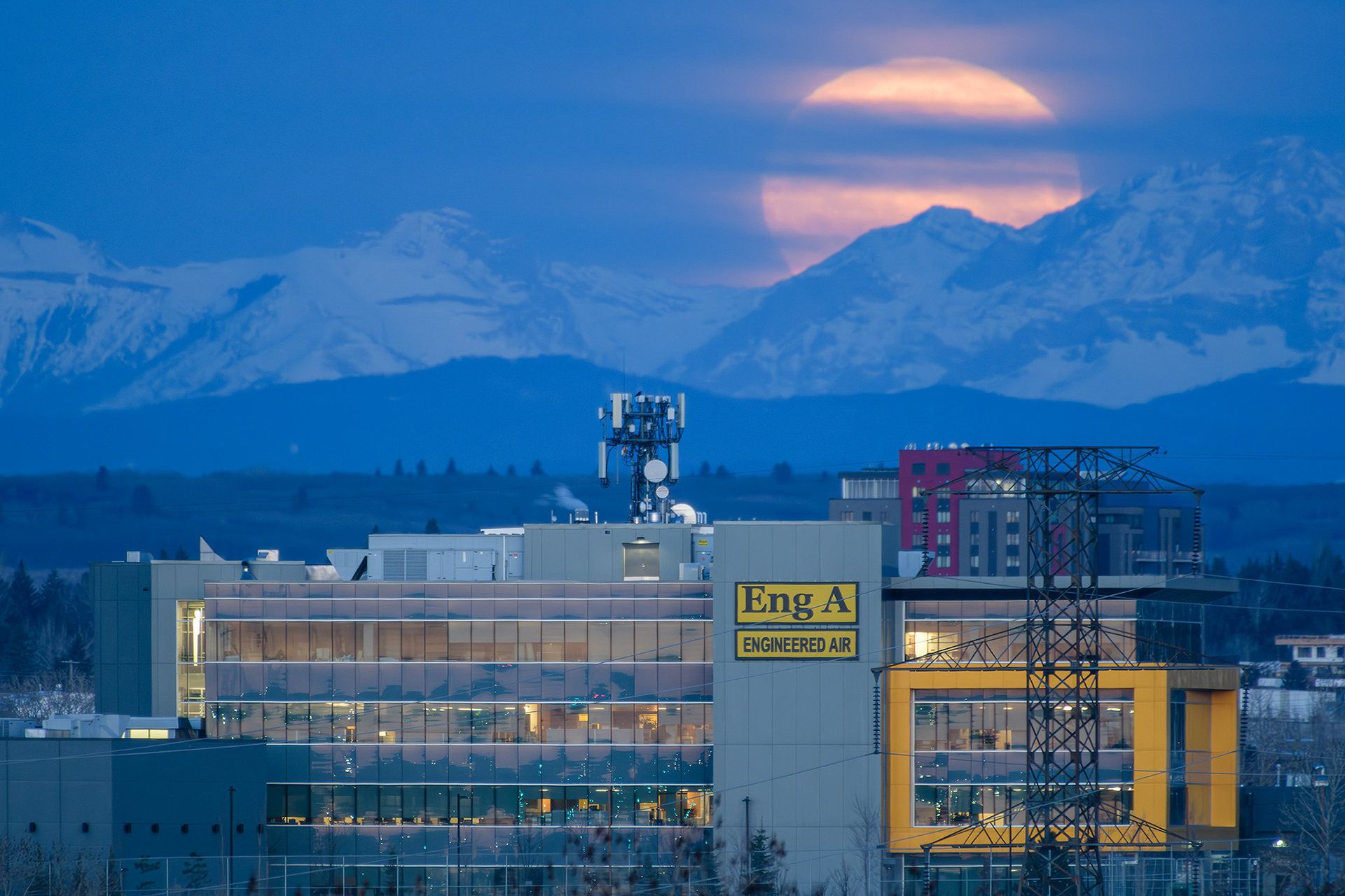 A photo of the Moon setting beyond the Rocky Mountains during Civil Twilight, from Southview Off Leash Dog Park, Calgary, AB - April 23rd