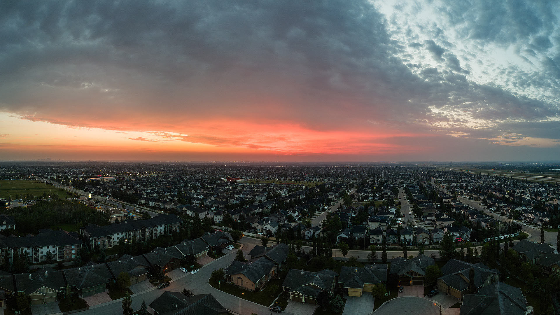 Panoramic sunrise aerial image from over the neighborhood of Bridlewood, Calgary, AB - August 18th