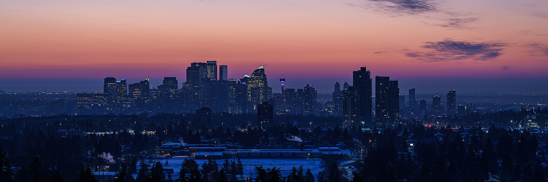 A photo of the Downtown Calgary skyline a half hour before Sunrise, from a park in Strathcona, Calgary, AB - March 20th (7:10 AM, 23 Mp, 3:1 crop)