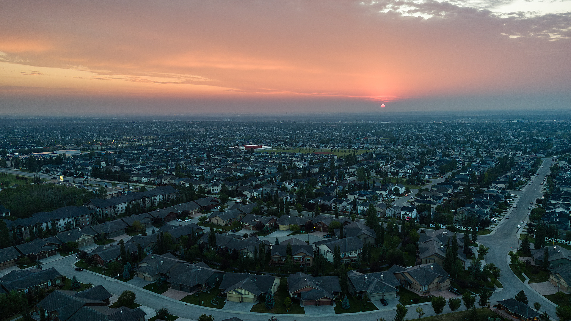 Sunrise aerial photo from over the neighborhood of Bridlewood, Calgary, AB - August 18th