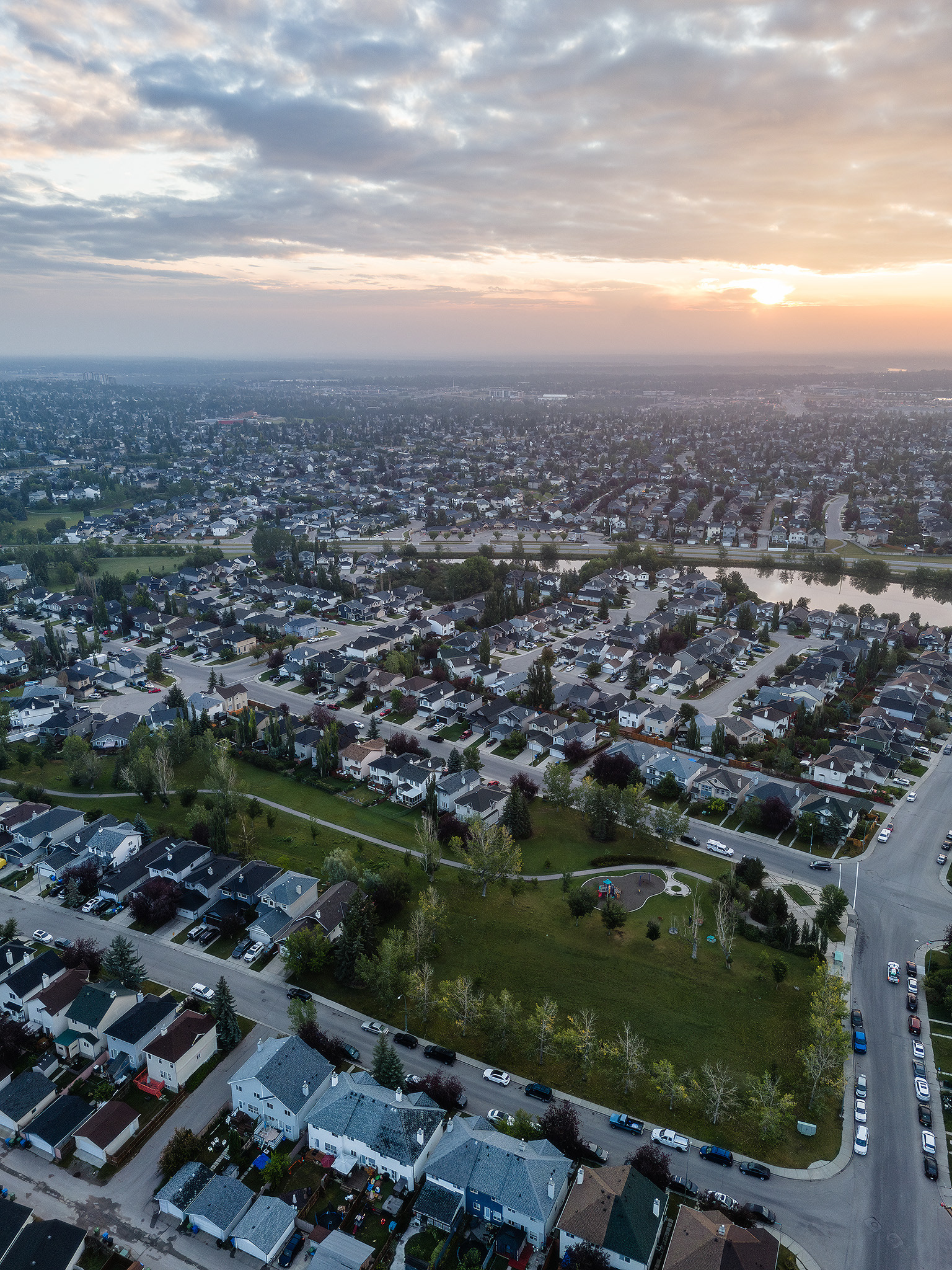 Sunrise aerial photo from over the neighborhood of Bridlewood, Calgary, AB - August 17th