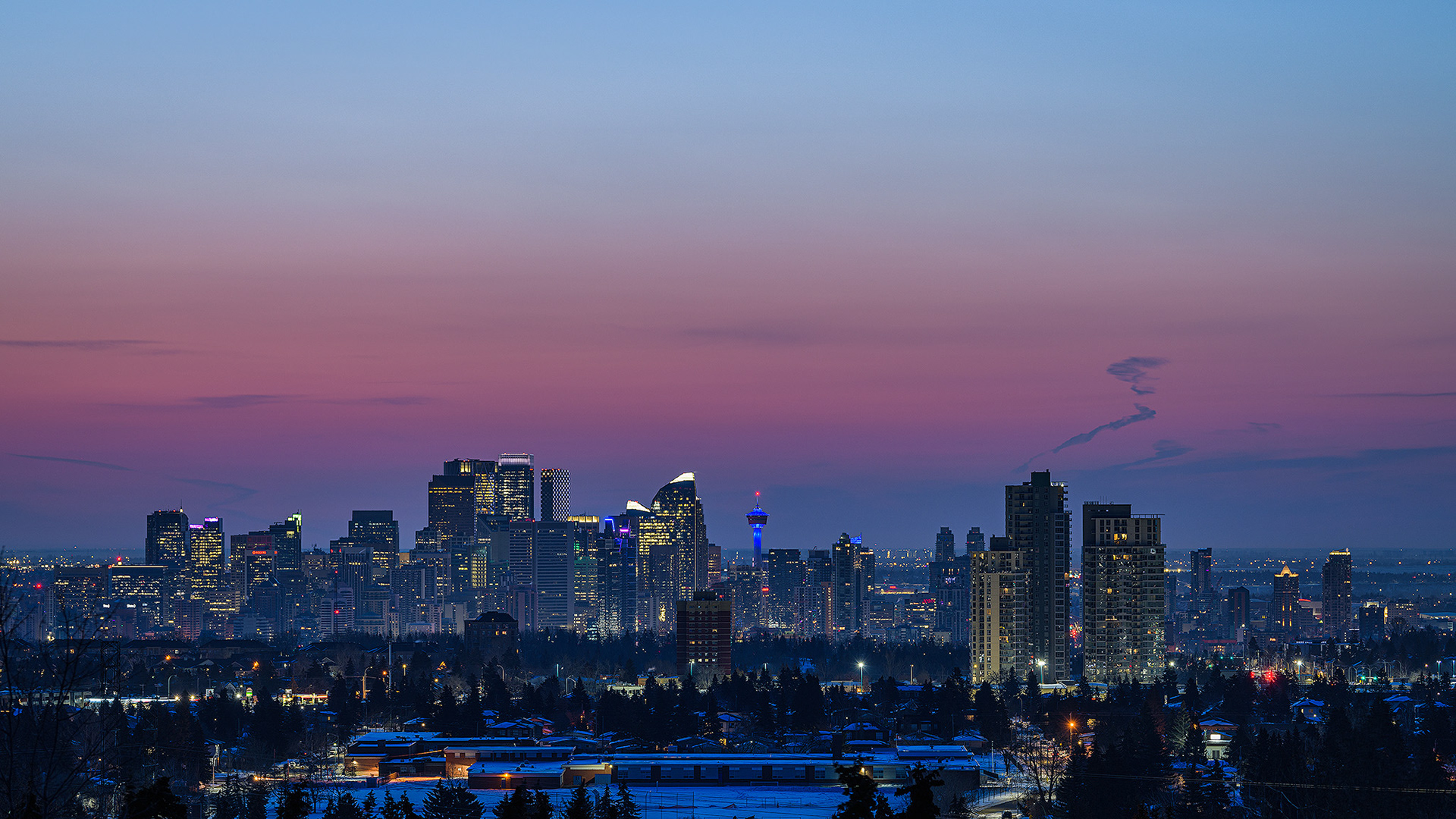 A photo of the Downtown Calgary skyline fourty minutes before Sunrise, from a park in Strathcona, Calgary, AB - March 19th (7:02 AM, 38 Mp, 16:9 crop)