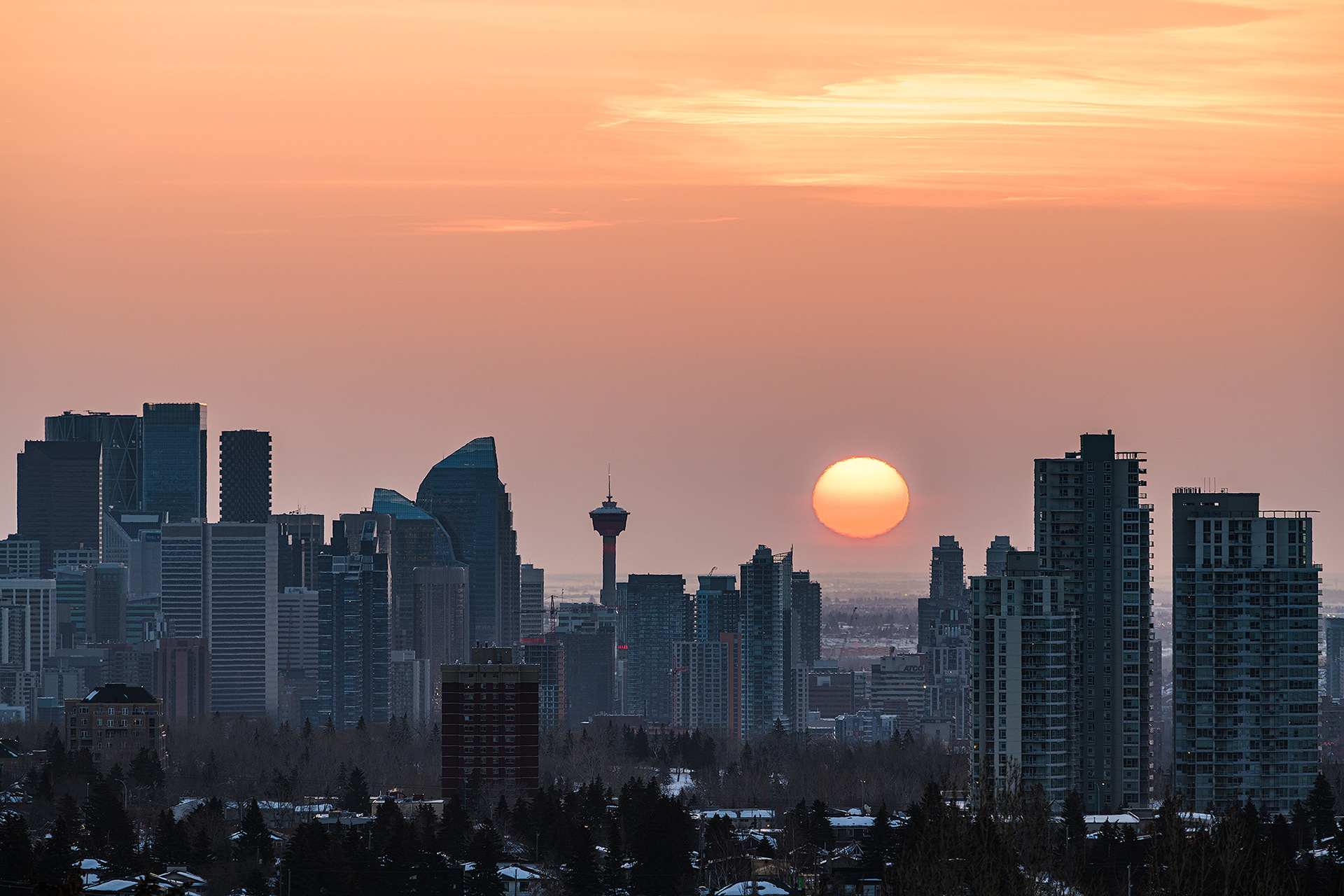 A photo of a portion of the Downtown Calgary skyline at Sunrise, from a park in Strathcona, Calgary, AB - March 18th (7:46 AM, 44 Mp)