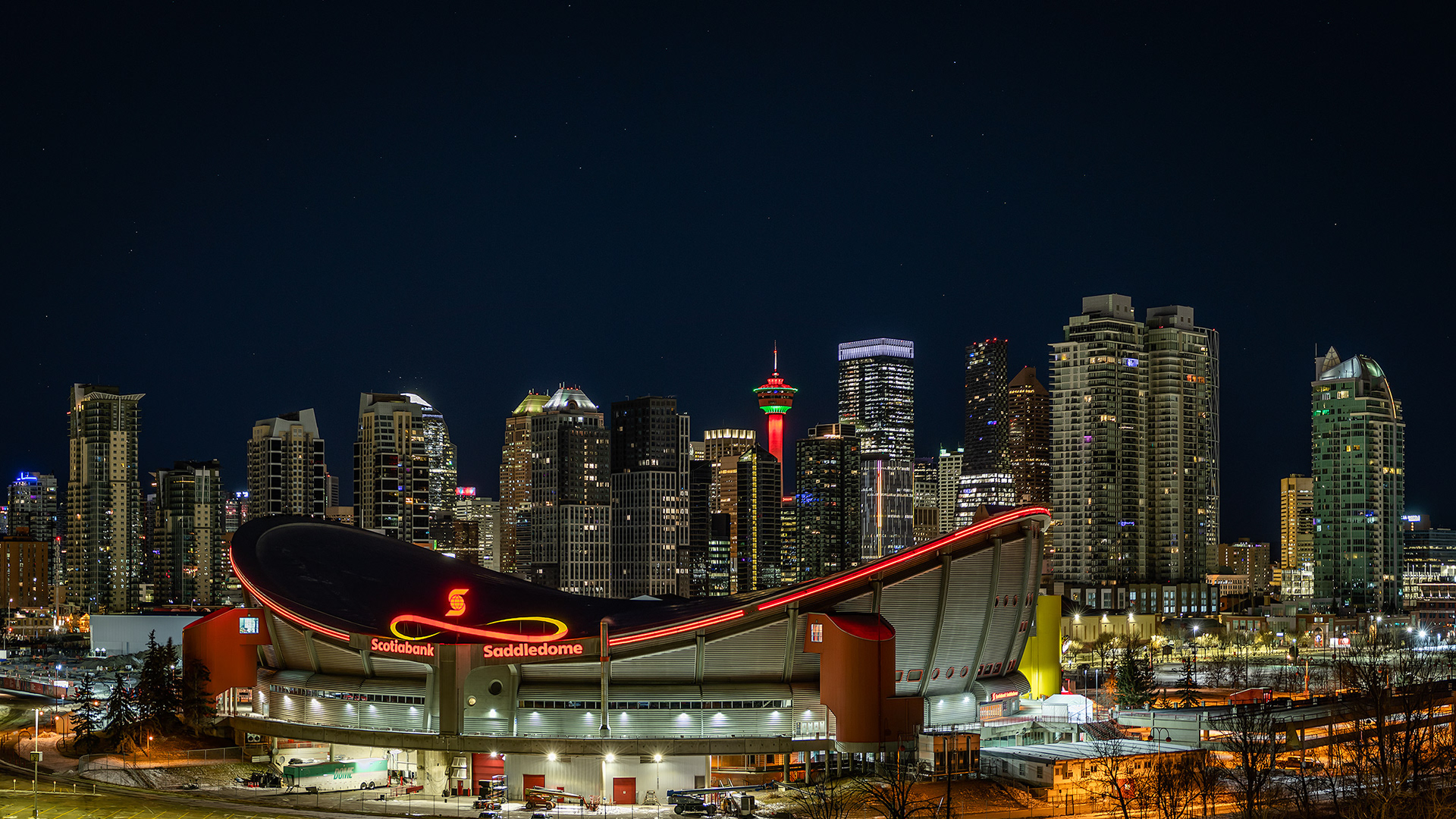 Cityscape (16x9 cropped out portion of the image shown above) of the Scotiabank Saddledome and downtown skyline from Scotsman's Hill, Calgary, AB