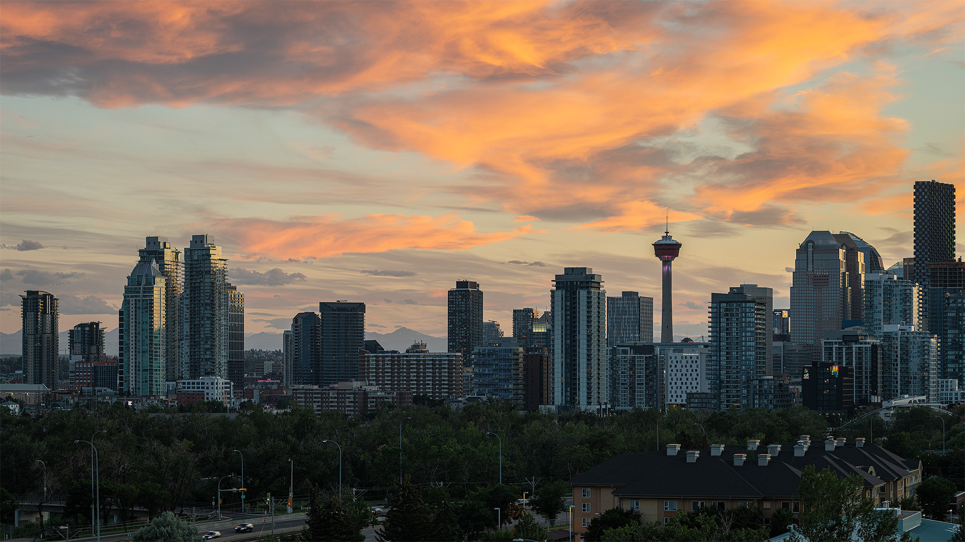 16x9 Cityscape of the Downtown Calgary skyline at Sunset, from Tom Campbell's Hill Natural Park, Calgary, AB