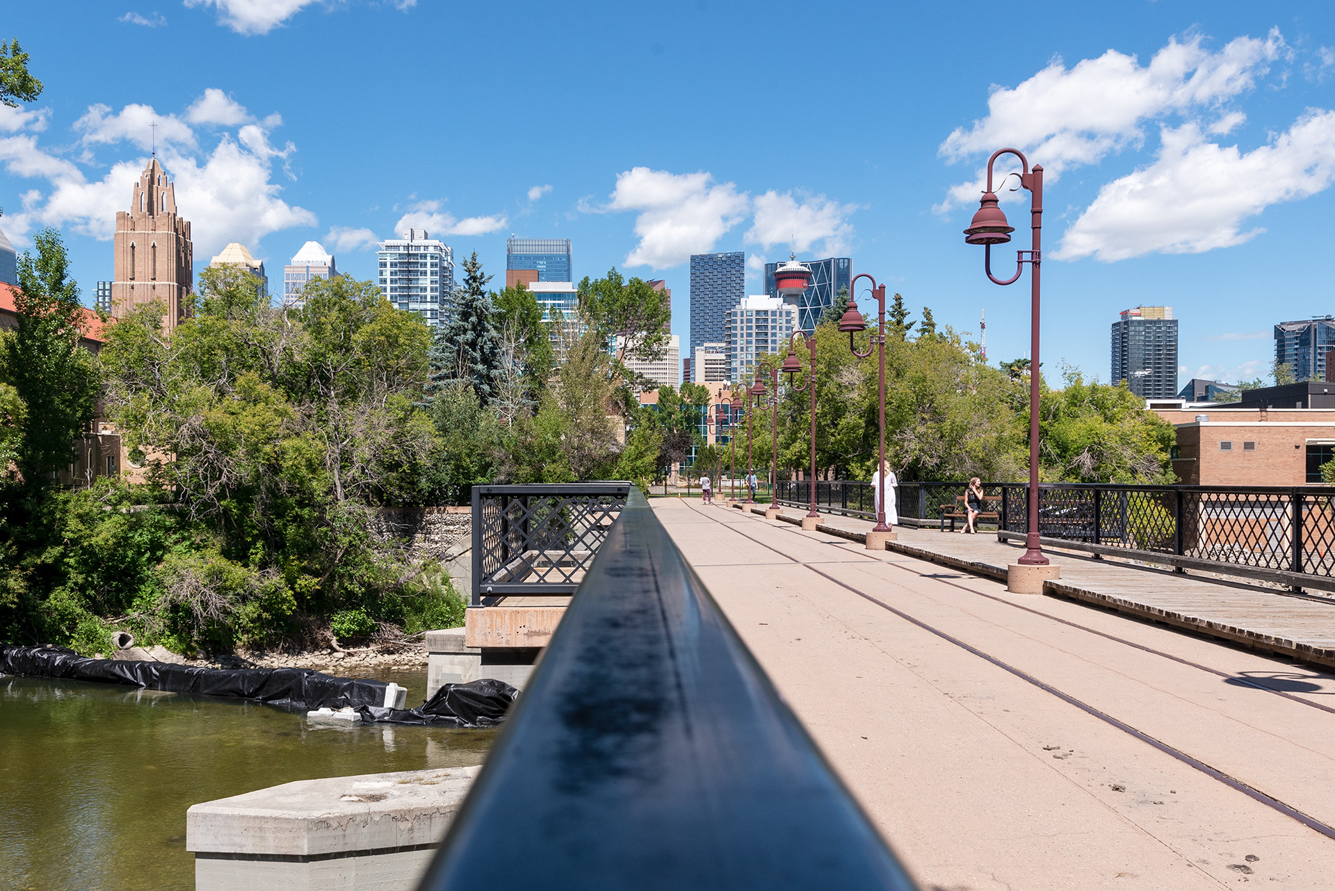 View of the Elbow River and part of the downtown skyline from a footbridge near Lindsay Park
