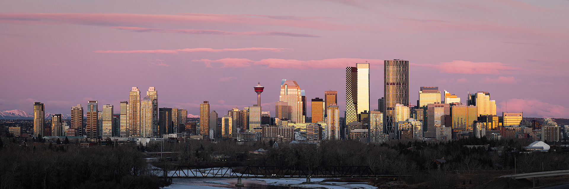 3x1 Panoramic Cityscape (8 shot) of the downtown skyline and Bow River [pre sunrise, Civil Twilight (sun altitude -0.4 degrees)], from near Max Bell Centre, Calgary, AB