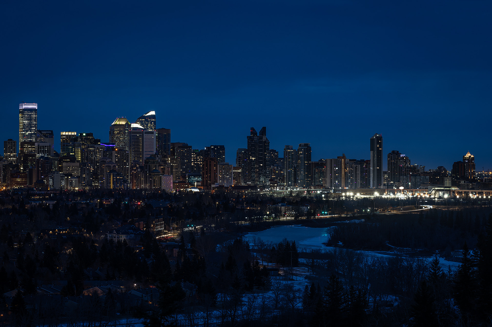 Cityscape, partial of the downtown skyline [pre sunrise, Nautical Twilight (sun altitude -6.9 degrees)] from Edworthy Park, Calgary, AB