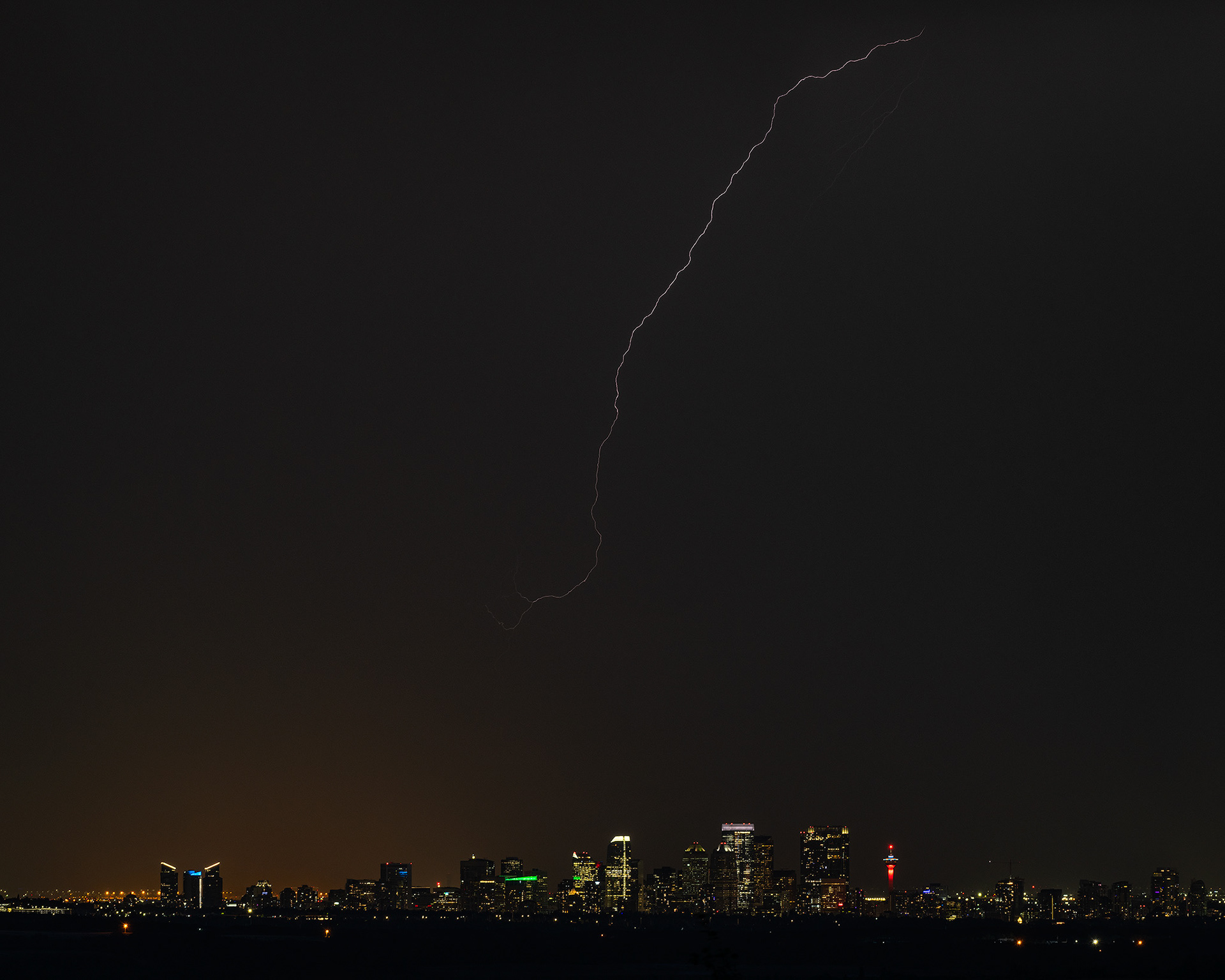 Cityscape of the Downtown Calgary skyline and Lightning, from near Ann and Sandy Cross Conservation Area, Foothills, AB