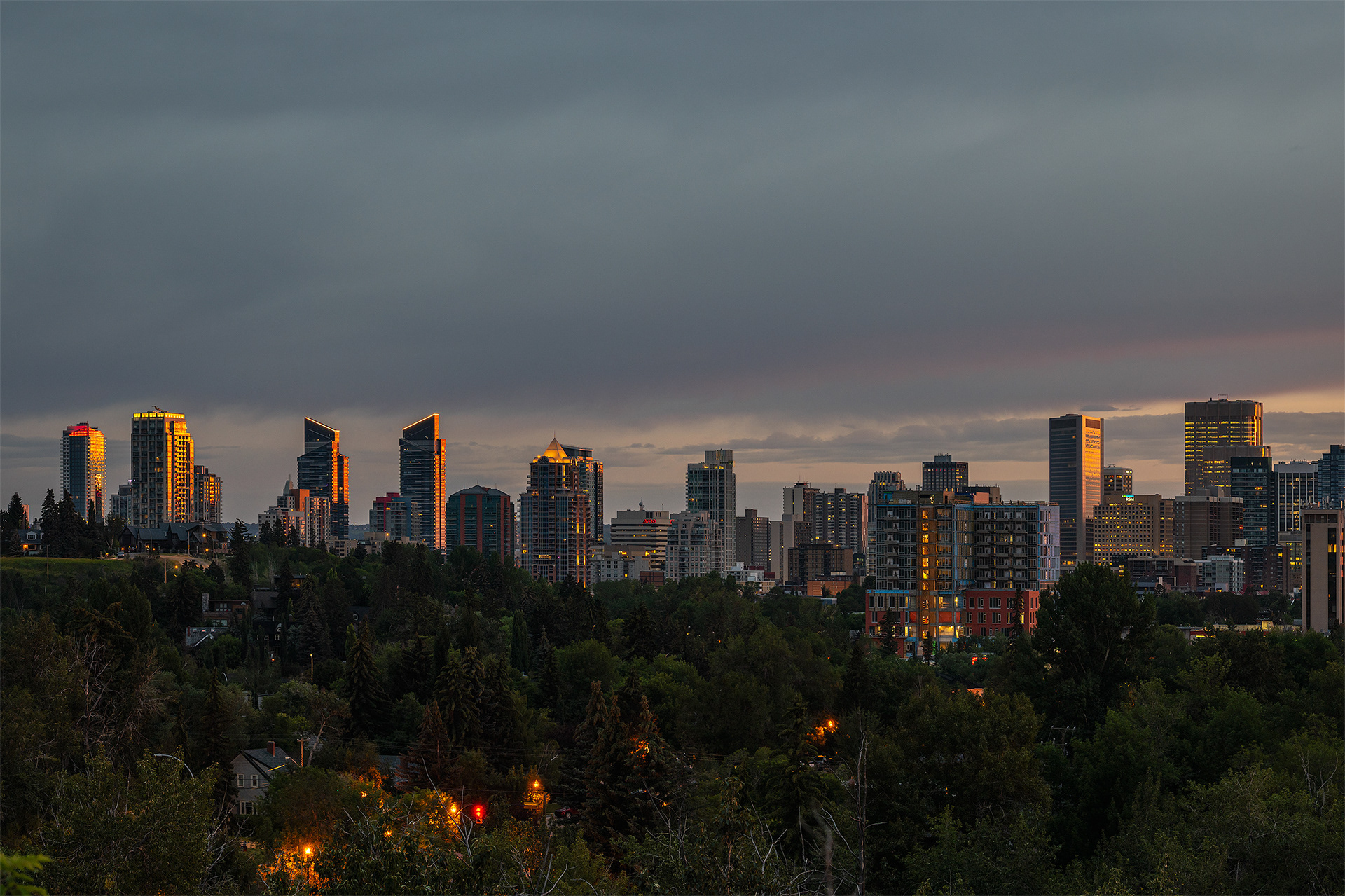 Cityscape of the Downtown Calgary West End skyline at Sunrise, from near Roxboro Park, Calgary, AB